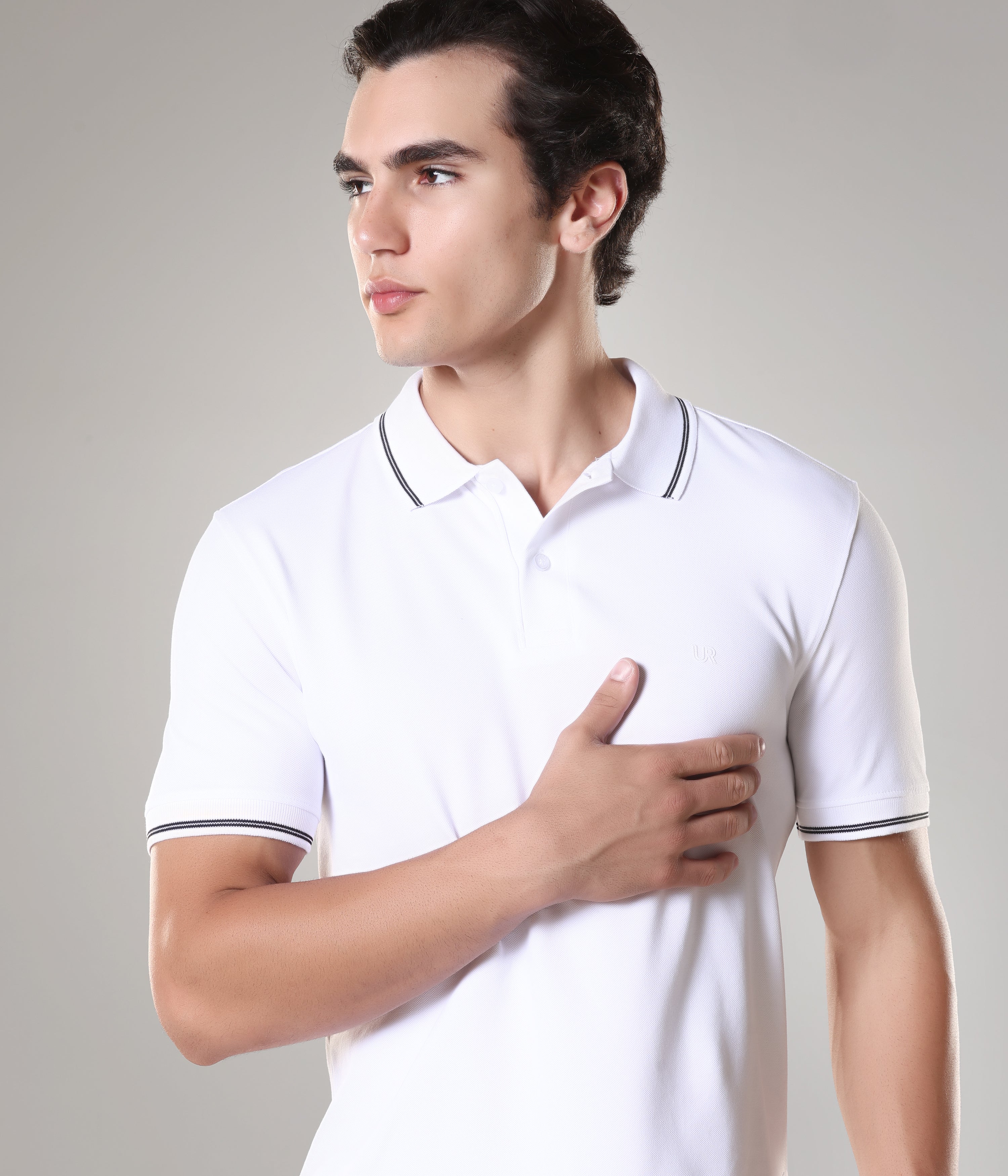 Man wearing Alpine Turms Polo T-shirt made of premium cotton with anti-stain, anti-odor, and anti-microbial features