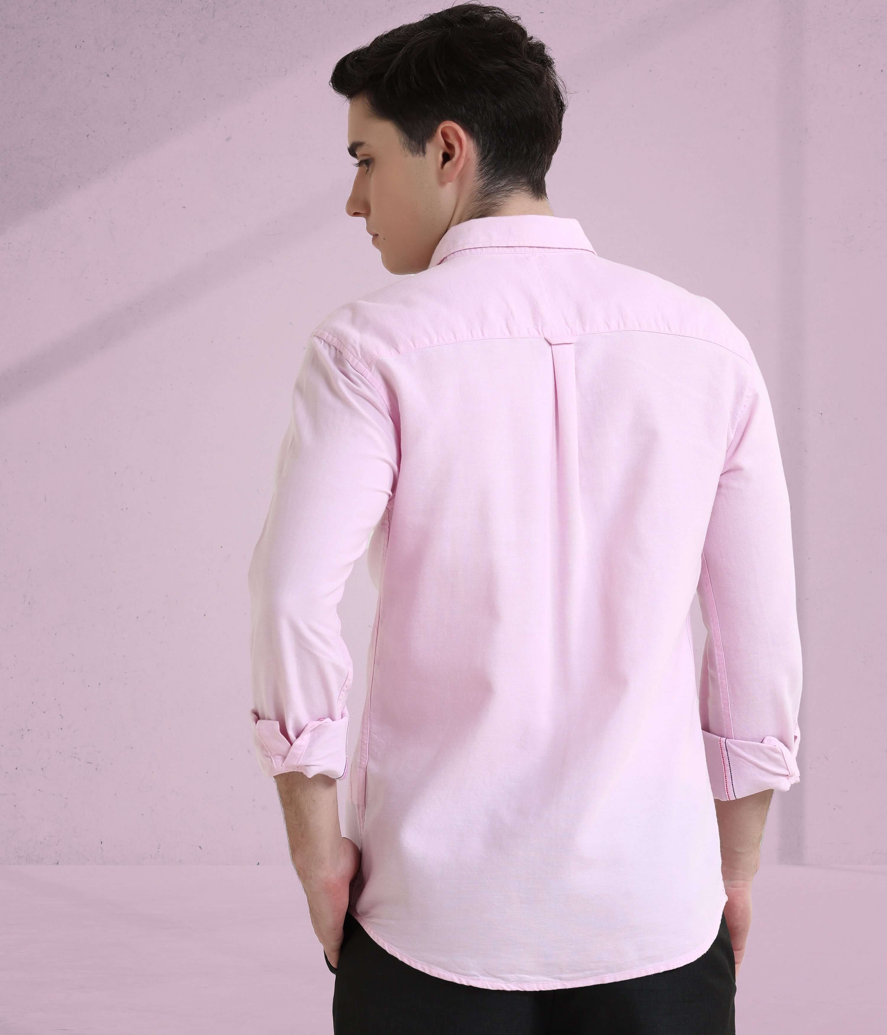 Back view of a man wearing a Mystic Pink Oxford Turms shirt, showcasing its premium cotton and stylish design.