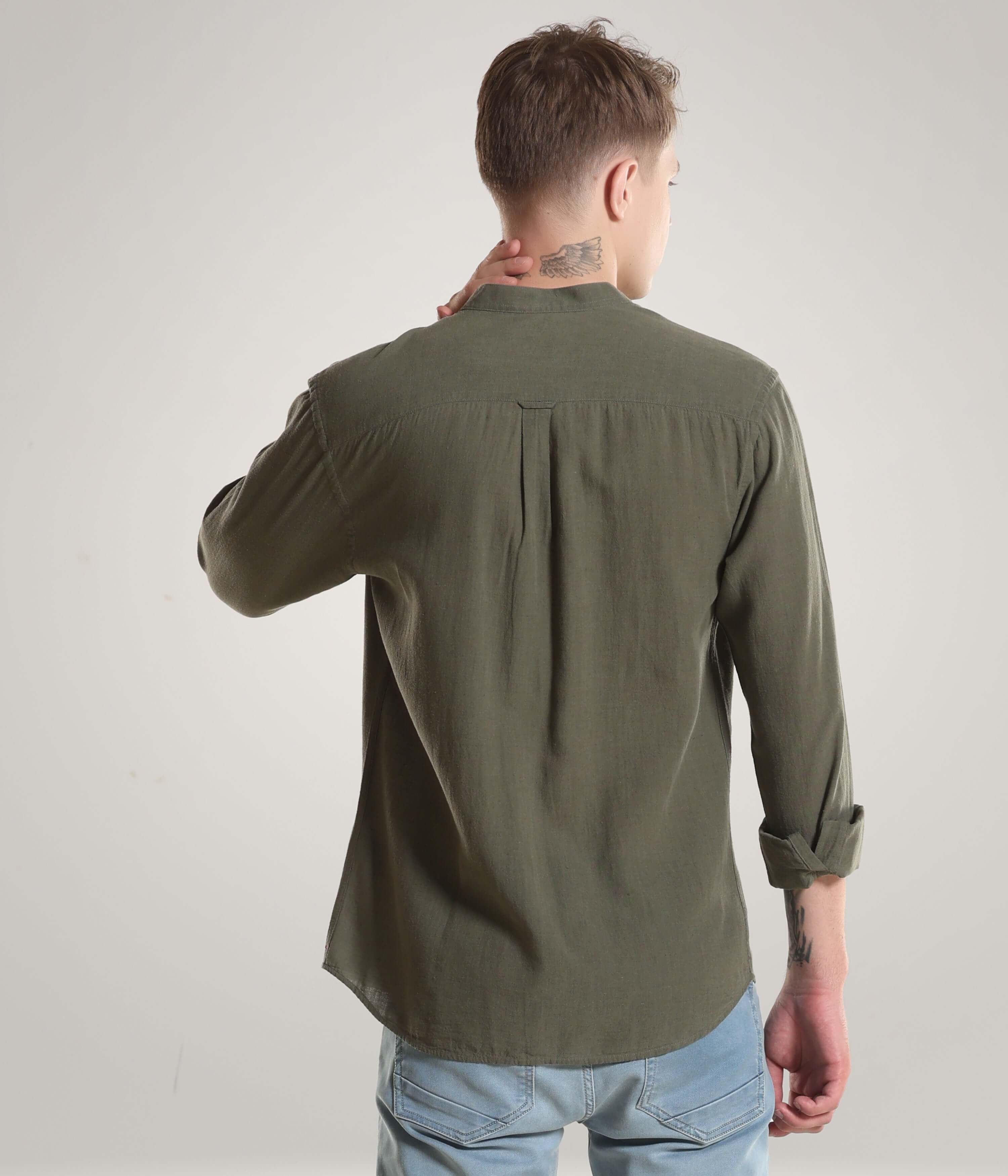 Man wearing Lichen Green Cotton/Linen Turms shirt with mandarin collar, showcasing premium stitching and durability.