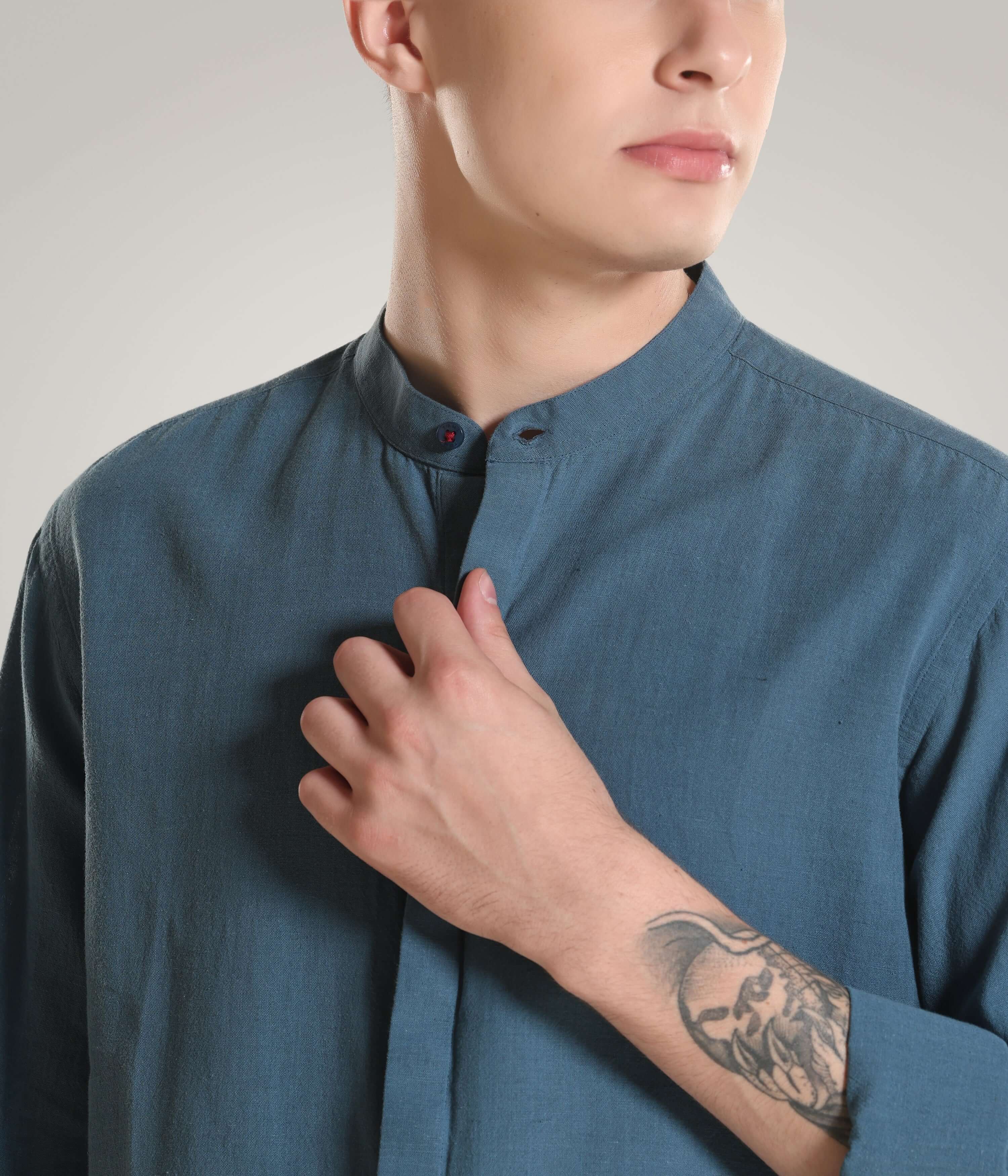 Man wearing Onyx Teal Cotton/Linen Turms shirt with mandarin collar, showcasing premium clothing with Cooltech, anti-stain, and anti-odour features.