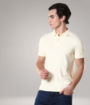 Man wearing yellow Turms intelligent apparel tailored fit polo T-shirt made from premium cotton. Anti-stain, anti-odour, and anti-microbial feature.