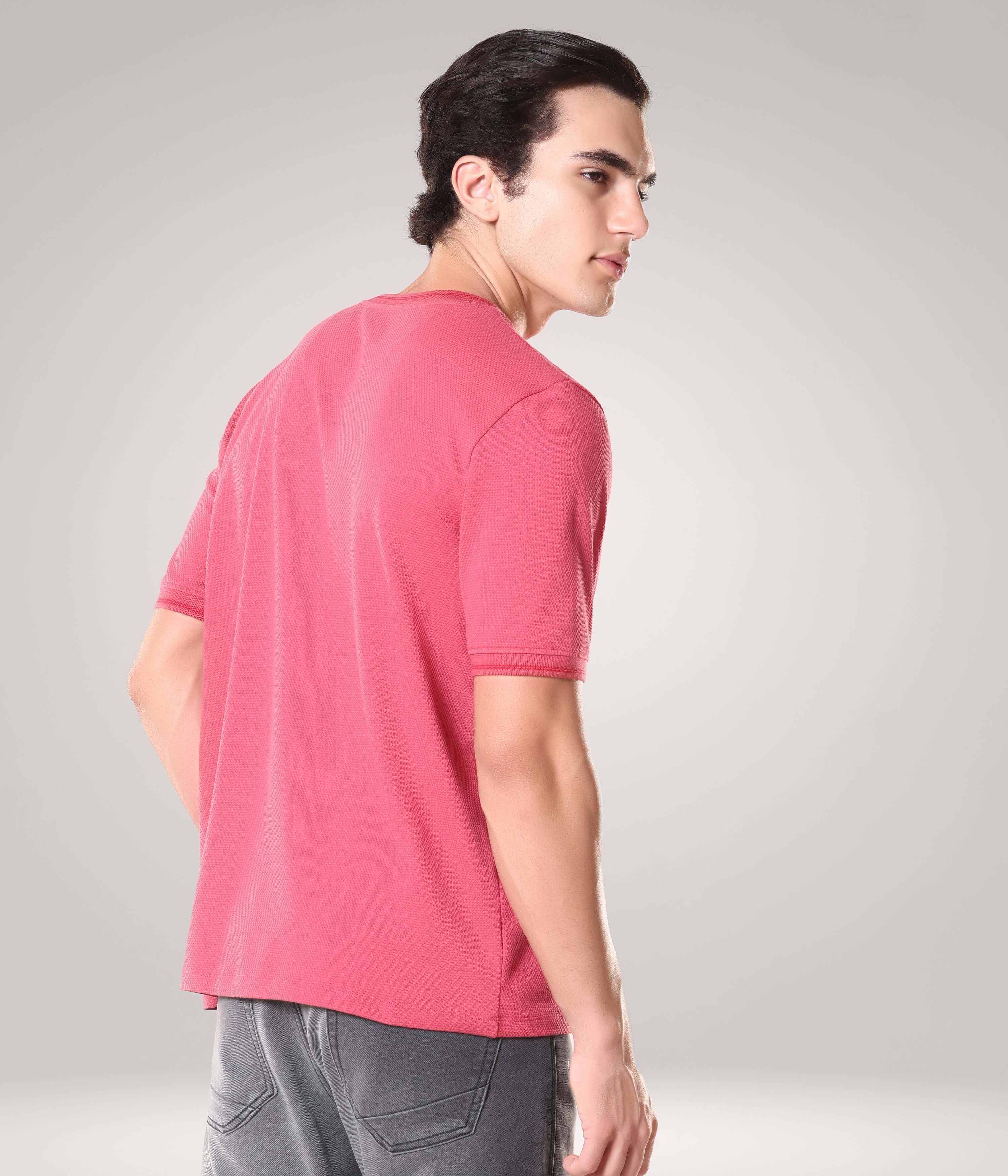 Man wearing a Regal Pink Turms T-shirt with crew neck, tailored fit, showcasing premium cotton CoolTech fabric and antimicrobial, anti-odour features.