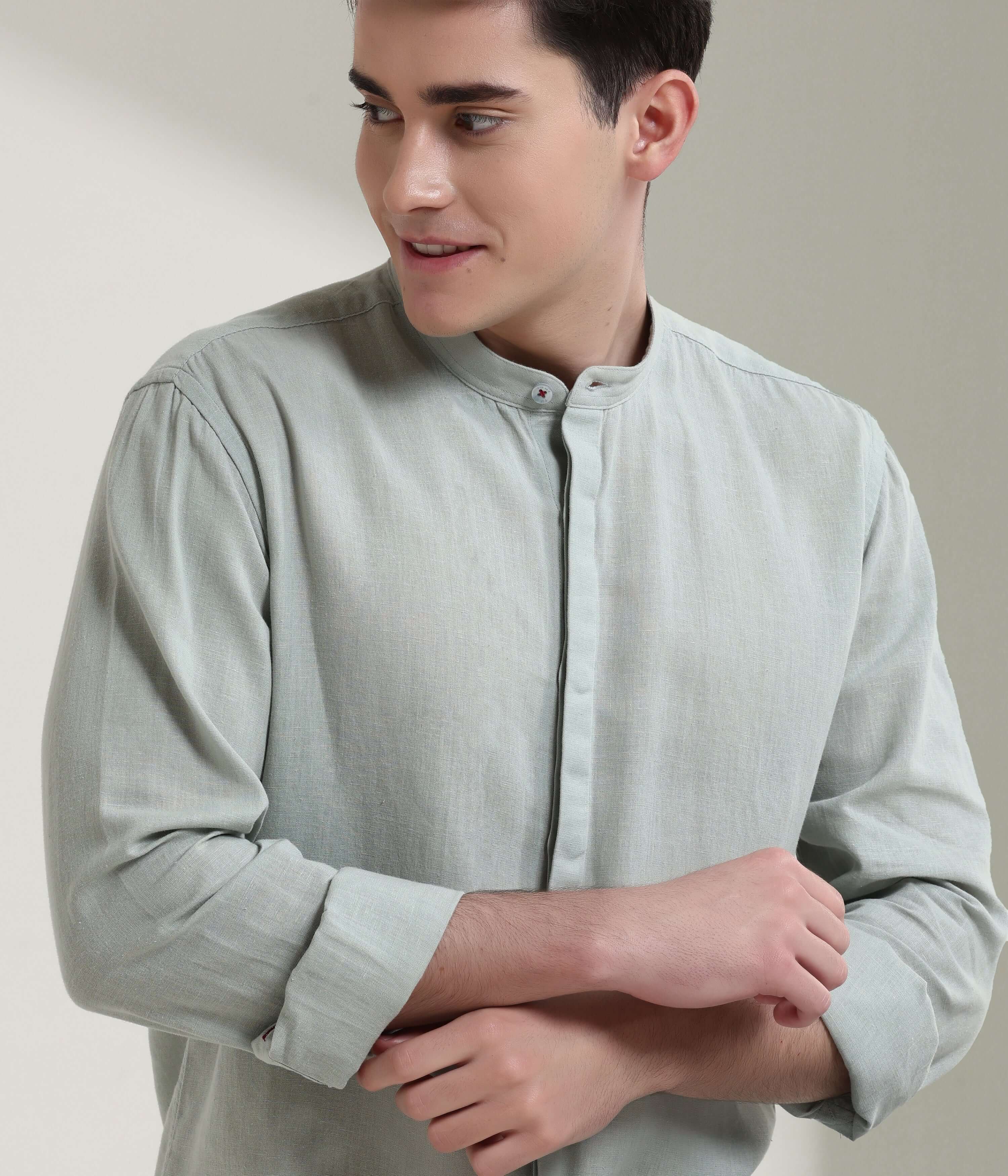 Man wearing a Storm Grey cotton-linen shirt with mandarin collar, featuring anti-stain and anti-odor intelligent apparel technology.