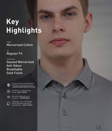 Model wearing a mercerised cotton polo shirt, featuring breathable, anti-odour technology in a sleek grey color.