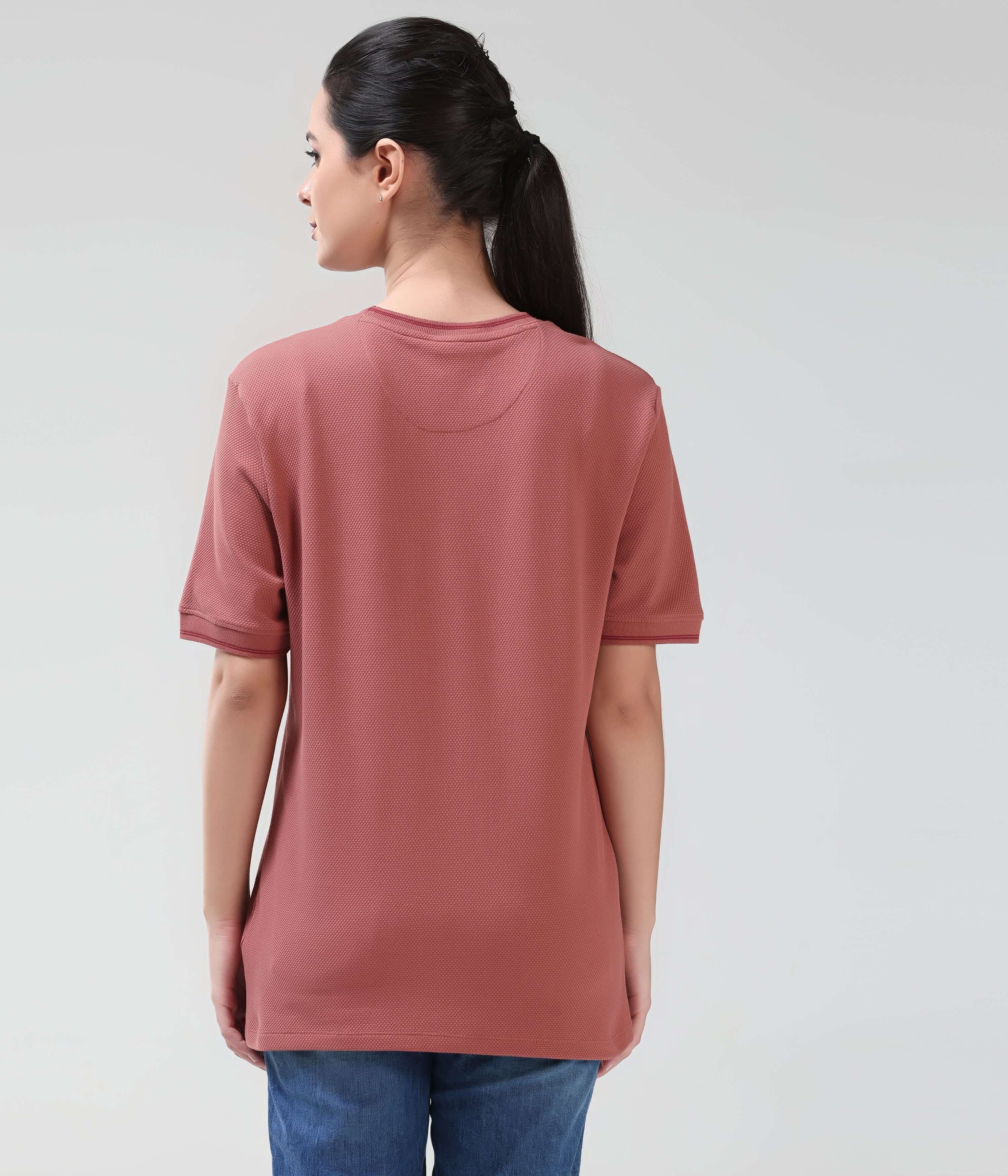 Rear view of woman wearing Vivid Brick Cooltech T-shirt with honeycomb fabric, tailored fit, and round neckline. Turms intelligent apparel, anti-odour.