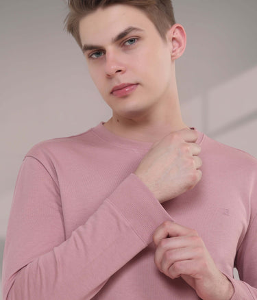 Model showcasing the Pink Rhythm sweatshirt, a stylish, breathable, and durable addition to menswear.