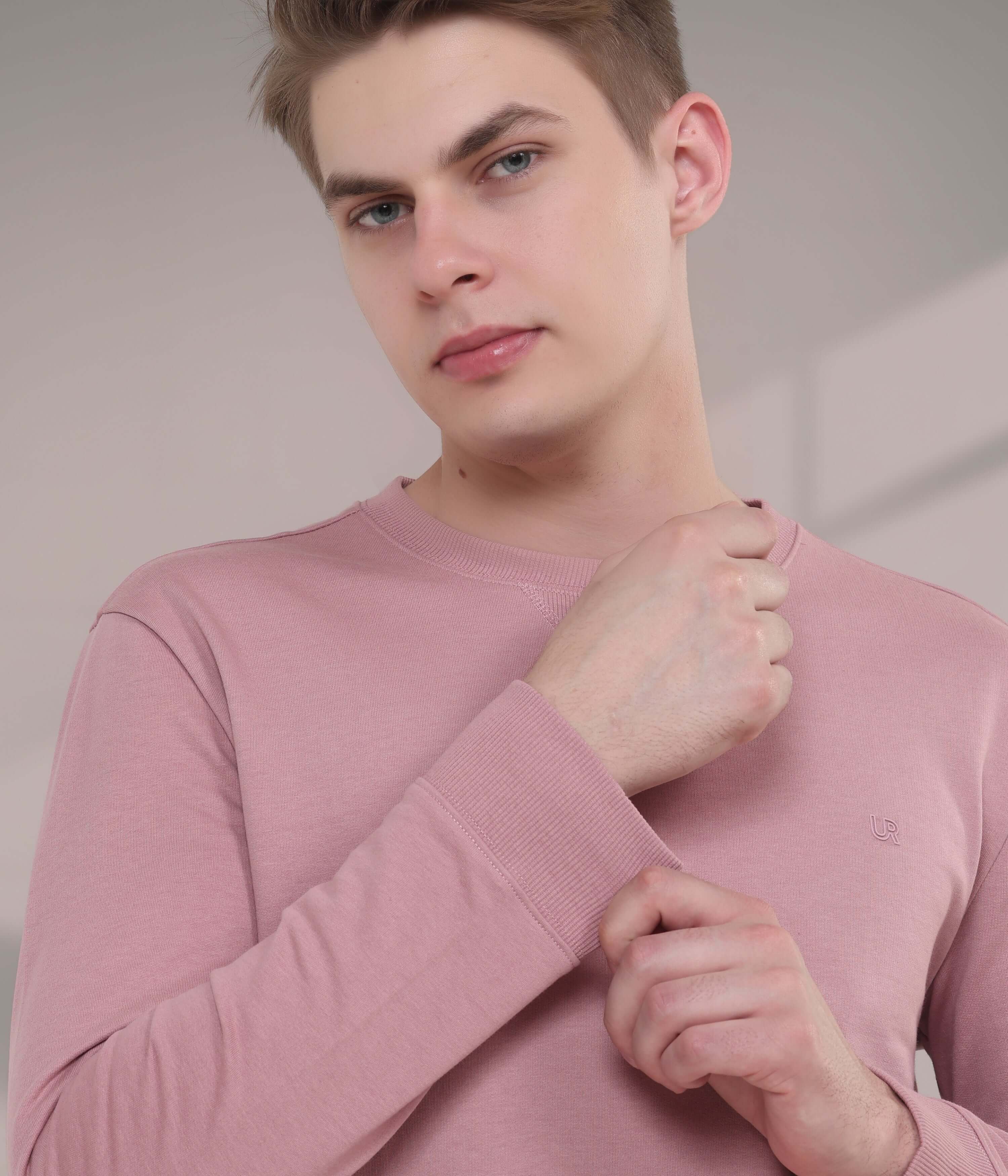 Model showcasing the Pink Rhythm sweatshirt, a stylish, breathable, and durable addition to menswear.