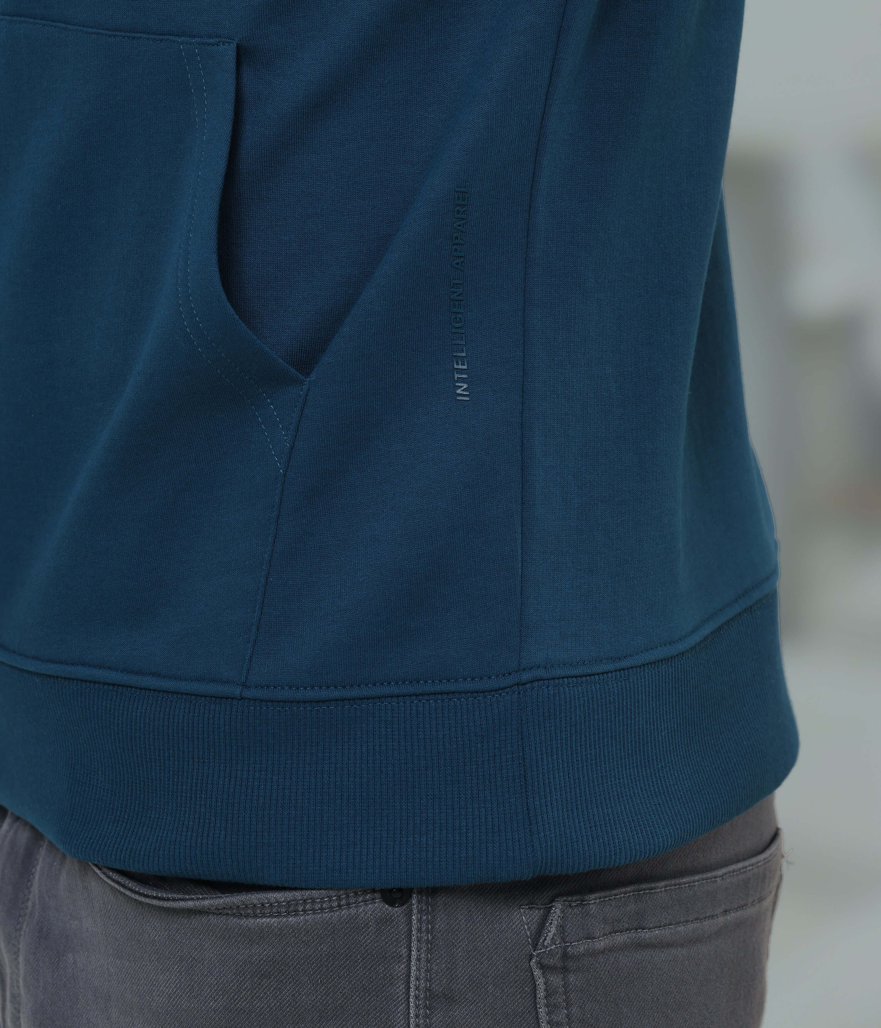 close-up of Turms Intelligent Hooded Sweatshirt in blue, highlighting soft fabric and smart design features for comfort and style