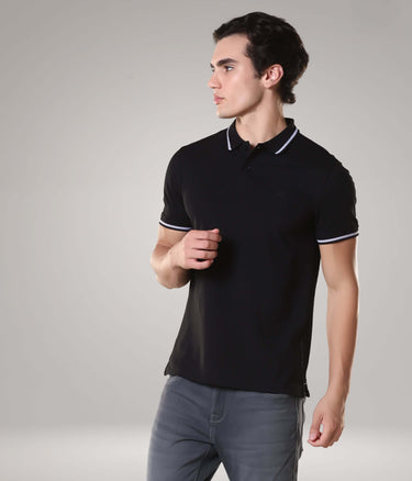 Man wearing black Turms intelligent apparel polo t-shirt with anti-stain, anti-odor, and antimicrobial features, made from premium cotton.