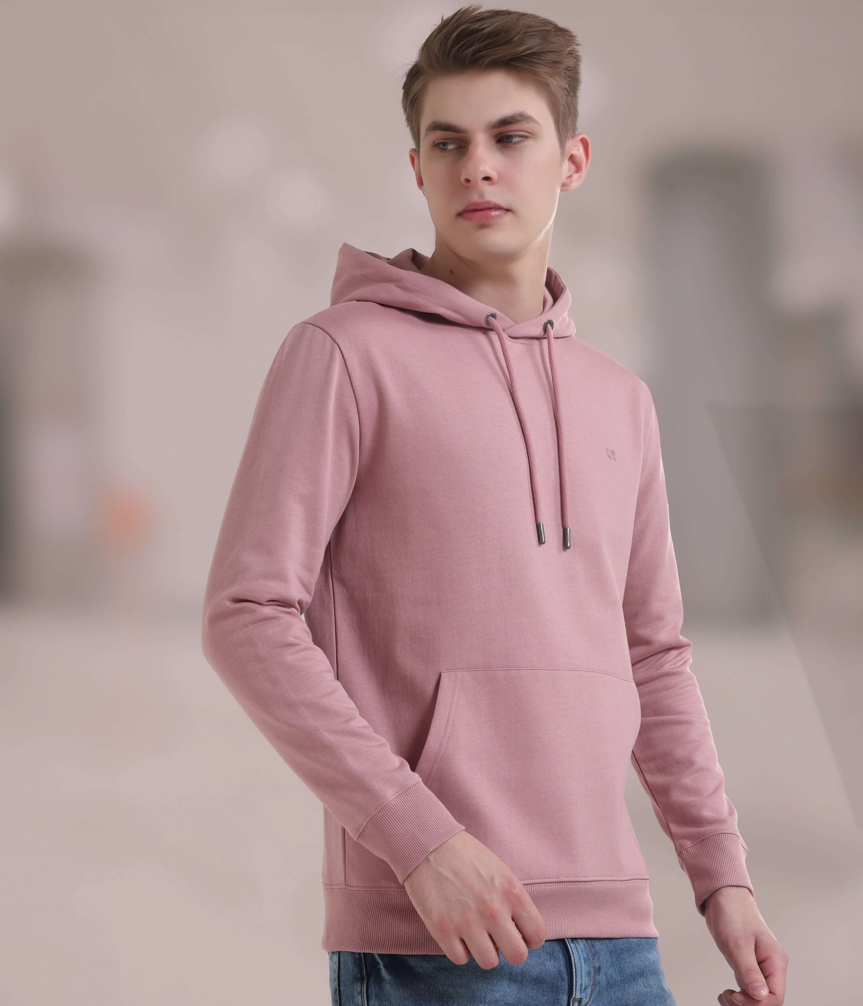 Stylish pink hooded sweatshirt for men, combining comfort and functionality with waterproof features. Ideal for everyday wear.