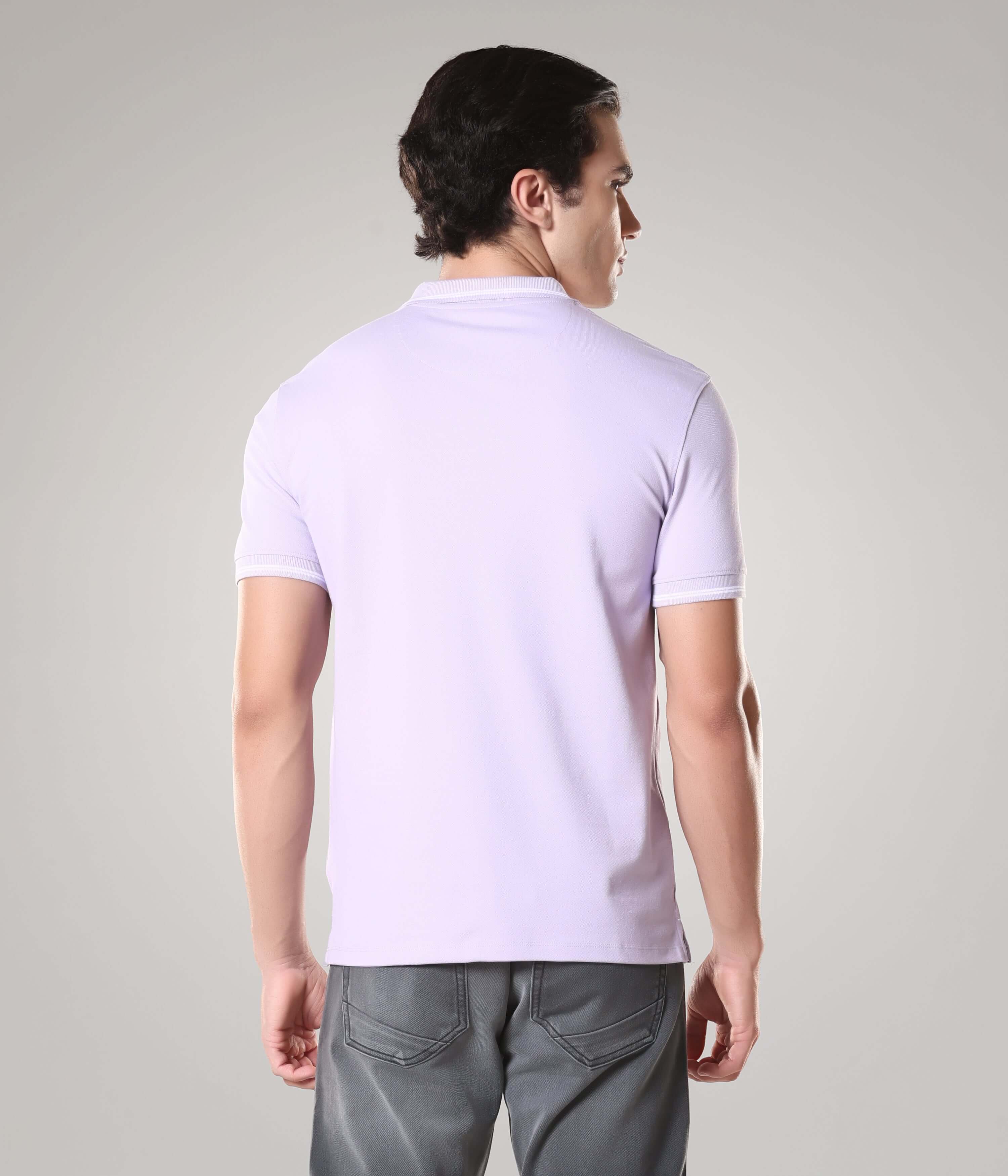 Back view of man wearing Turms intelligent apparel anti-stain, anti-odor polo T-shirt in light color, made from premium cotton and spandex.