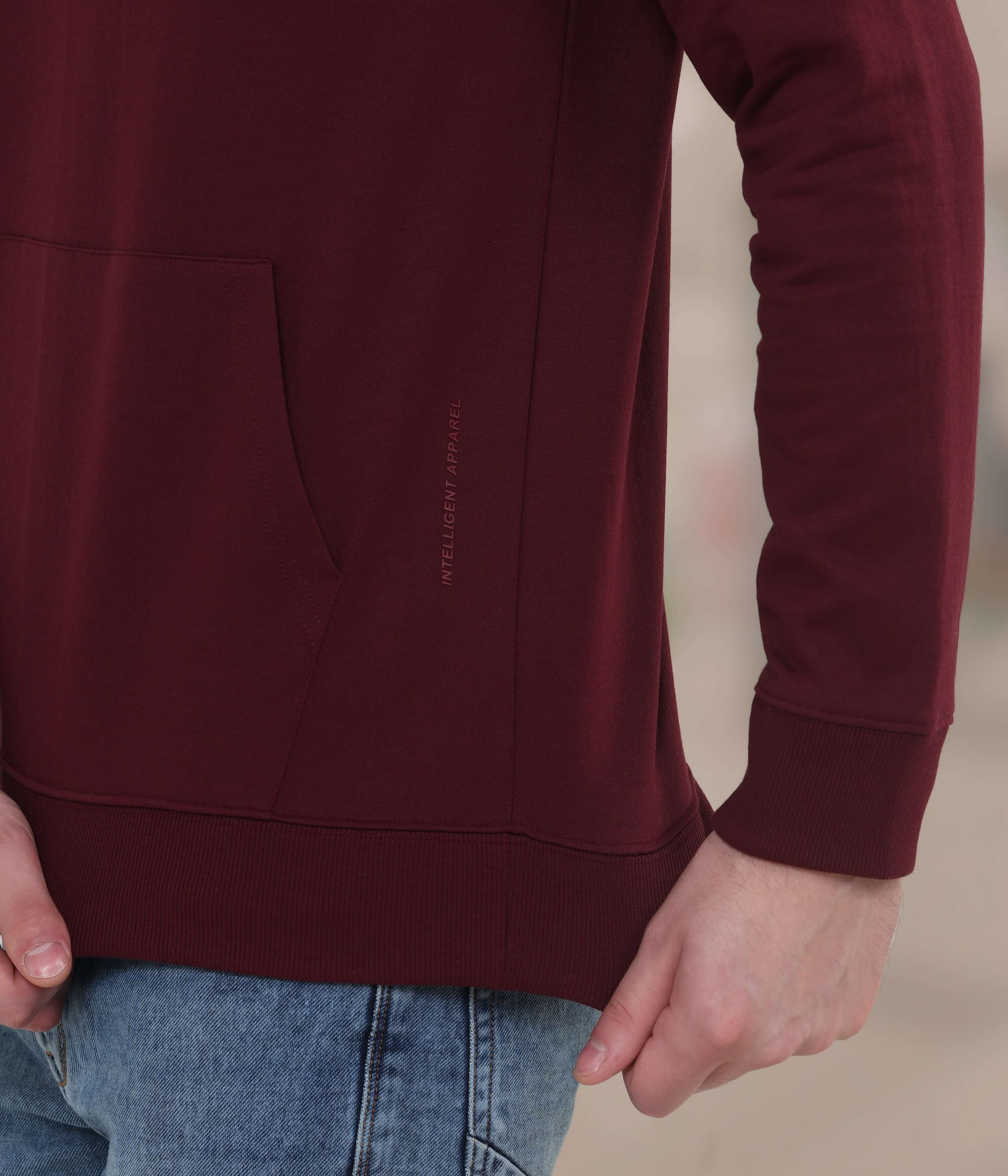 Close-up of maroon Turms Intelligent Hooded Sweatshirt showcasing pocket and premium fabric, ideal for stylish, durable menswear.