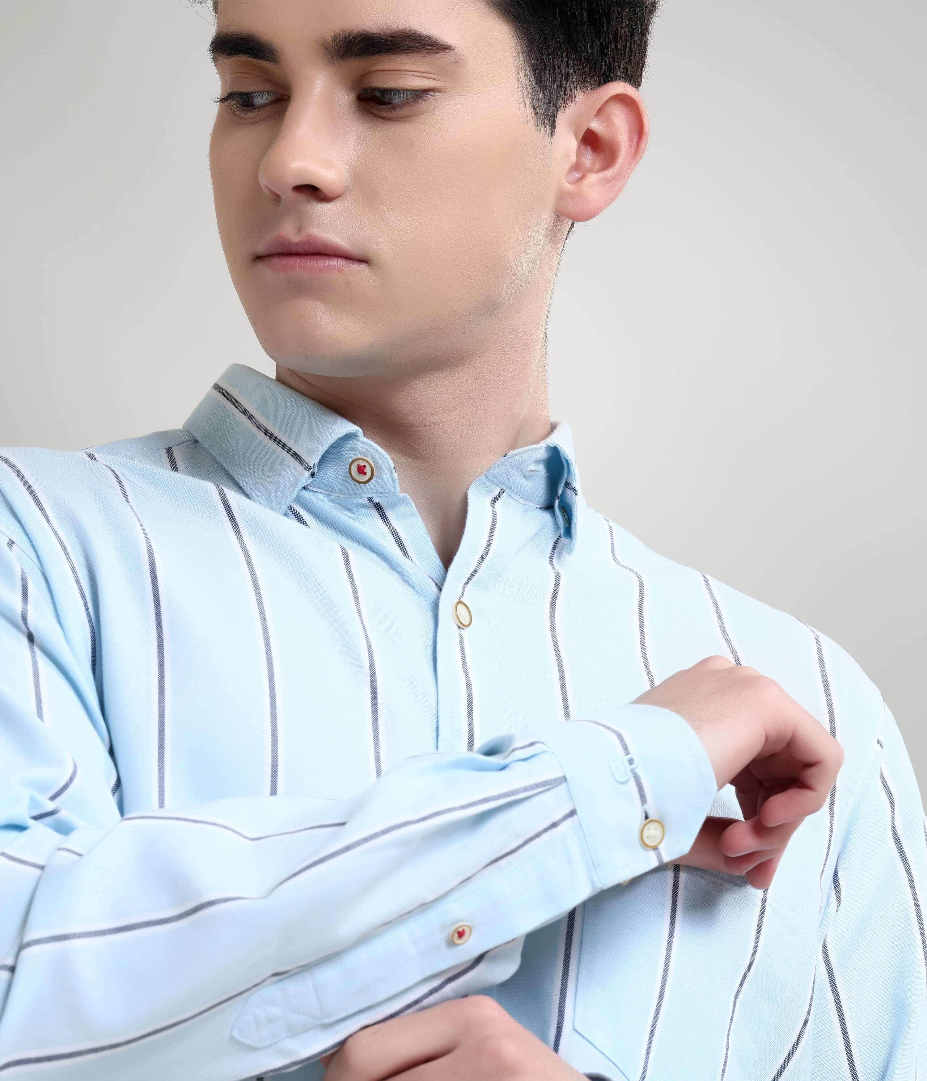 Man wearing Monochrome Blue Oxford Turms stripe shirt, featuring premium knitted cotton, anti-stain and anti-odour technology.