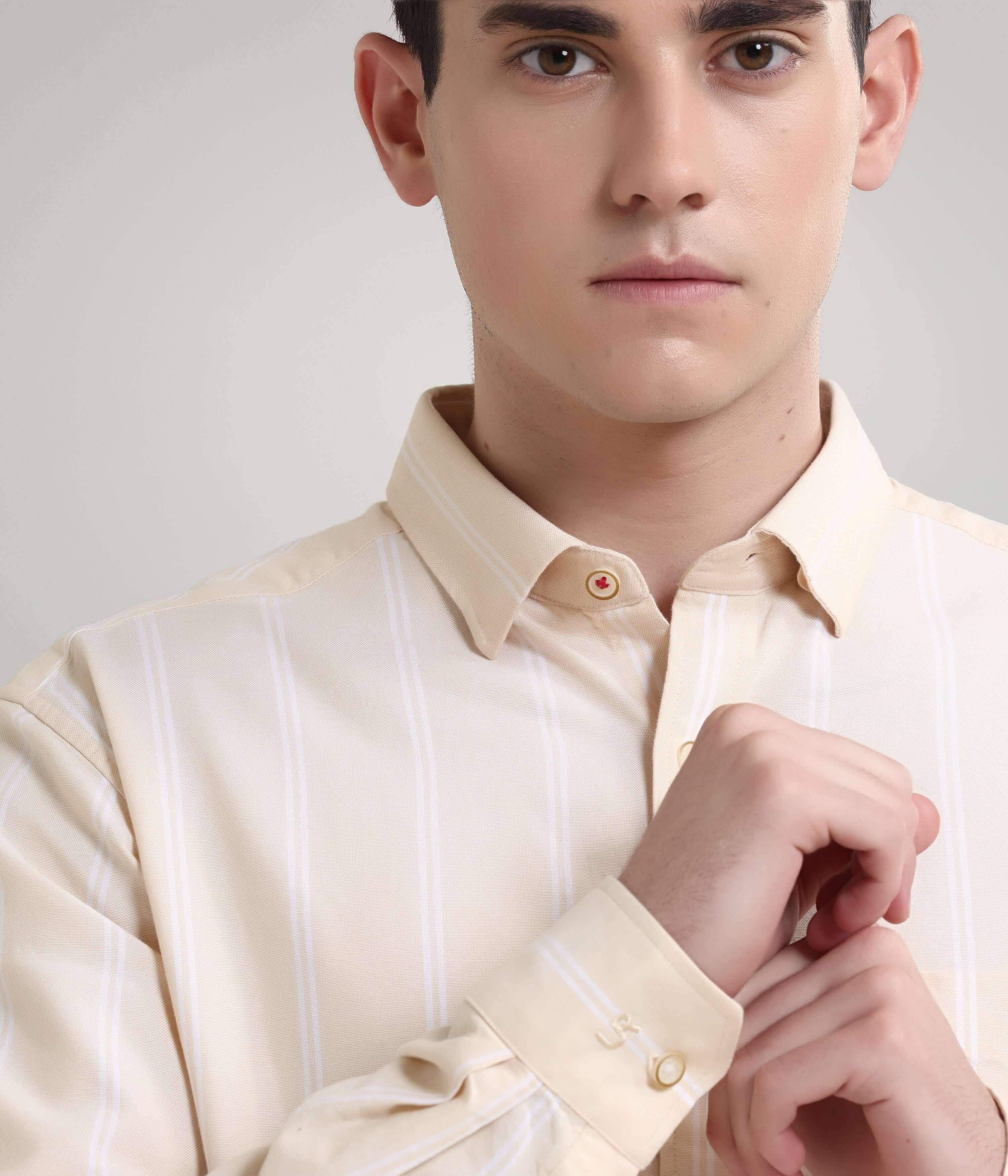 Man wearing a Dessert Beige Oxford Turms knitted stripe shirt with premium concealed button collar, anti-stain and anti-odour features.