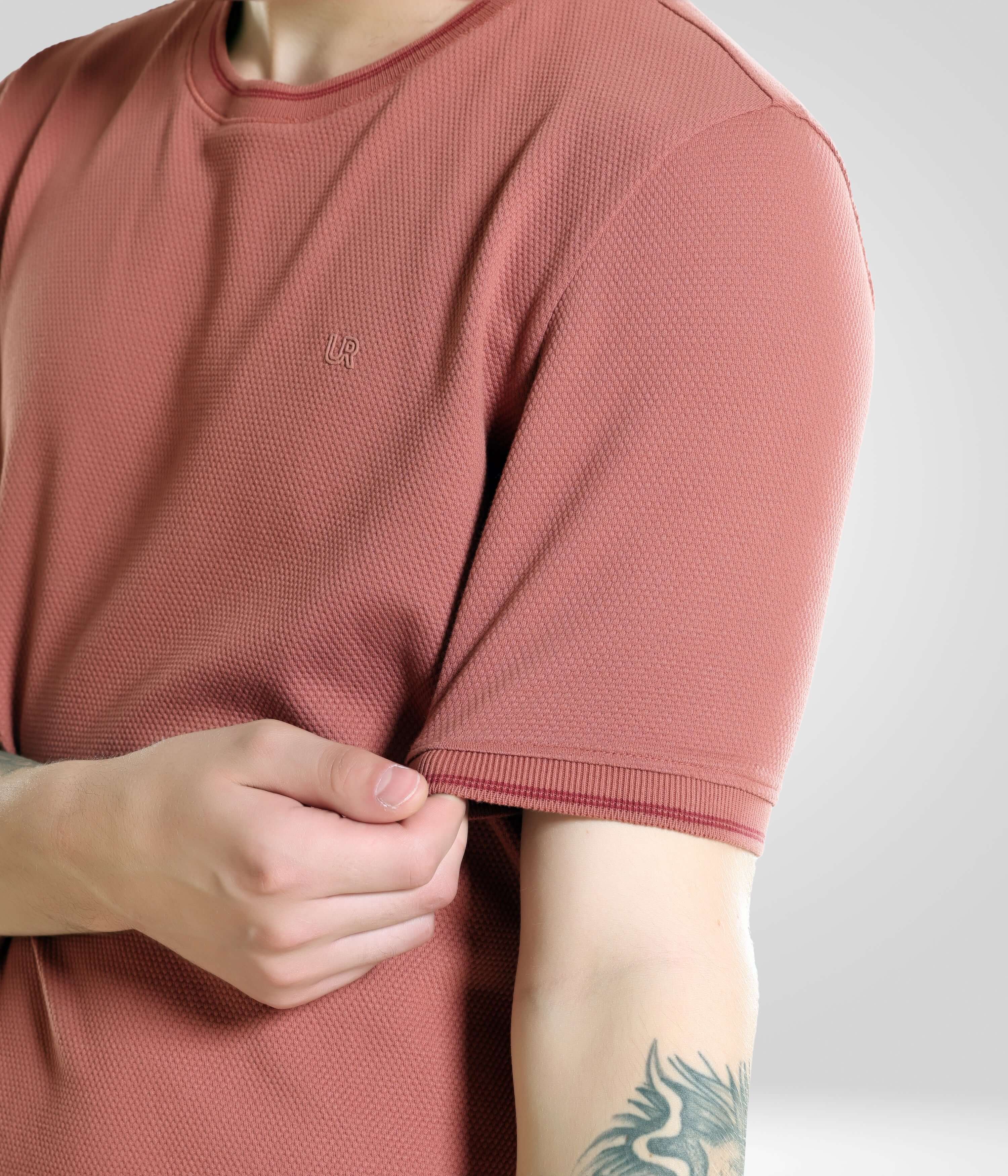 Close-up of a model wearing a Vivid Brick Turms T-shirt, showcasing the tailored fit and crew neck design in menswear.