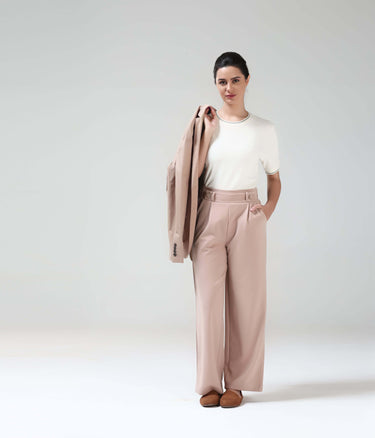 Woman wearing Pearl Off White Cooltech T-shirt by Turms with Honey Comb Fabric, showcasing new color and anti-odour intelligent apparel.