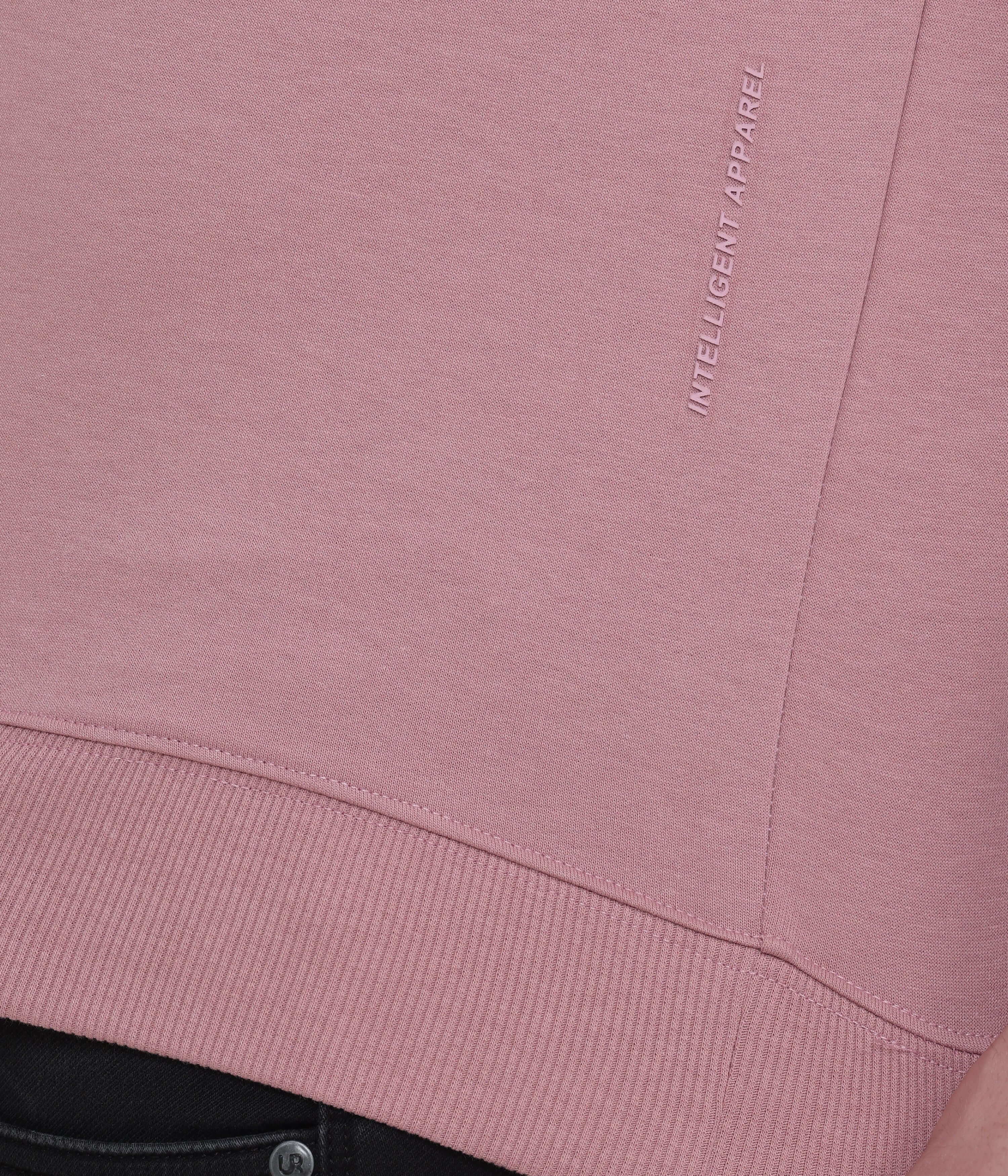 Close-up of the pink Turms Intelligent Sweatshirt showcasing premium fabric and sleek logo detail.