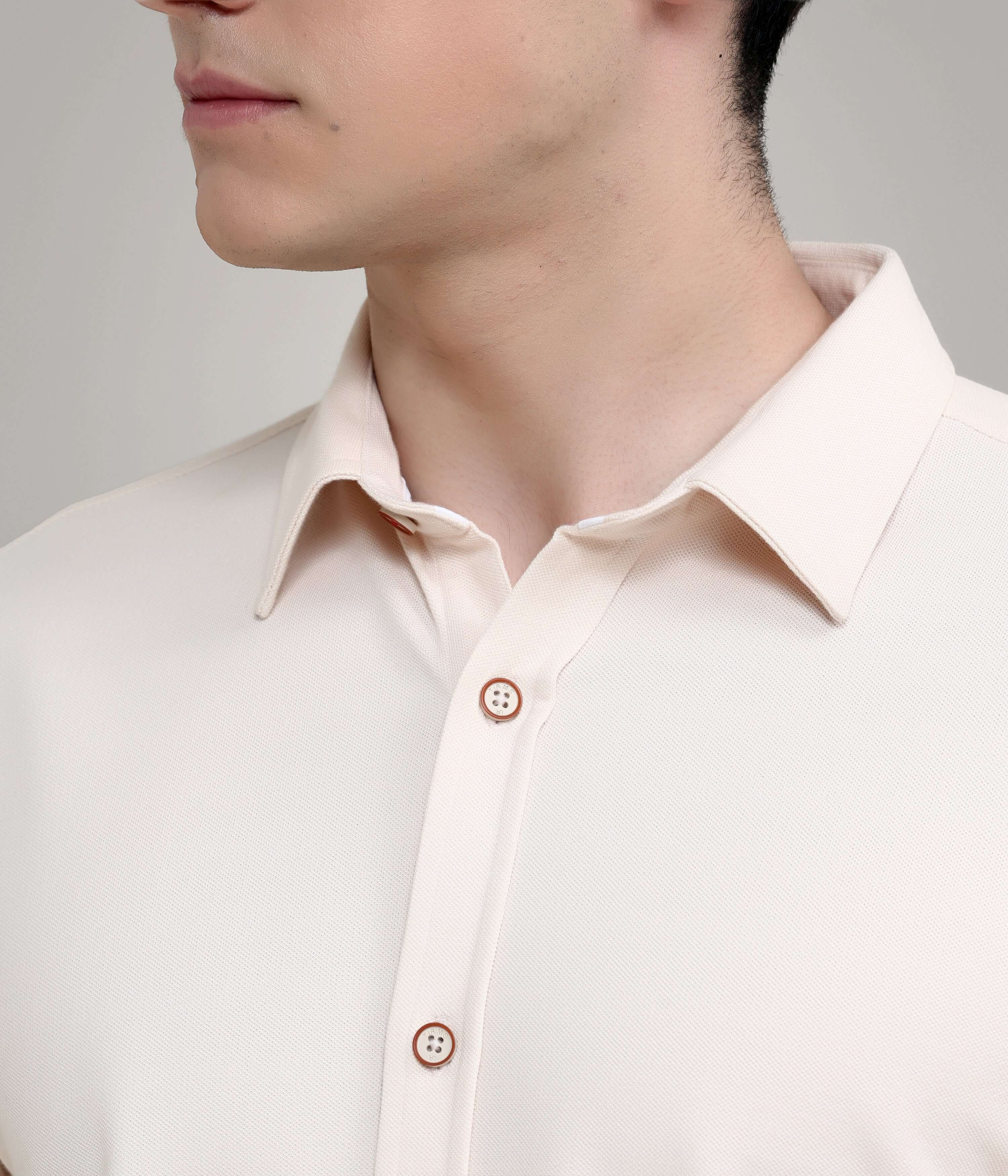 Dusky Beige knitted stretch shirt showcasing premium menswear with anti-stain, anti-odor features and stylish buttons.