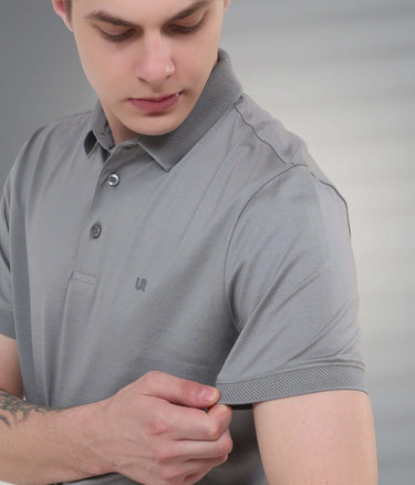 Grey polo t-shirt on a model showcasing its tailored fit and premium fabric features such as stain-proof and anti-odor qualities.