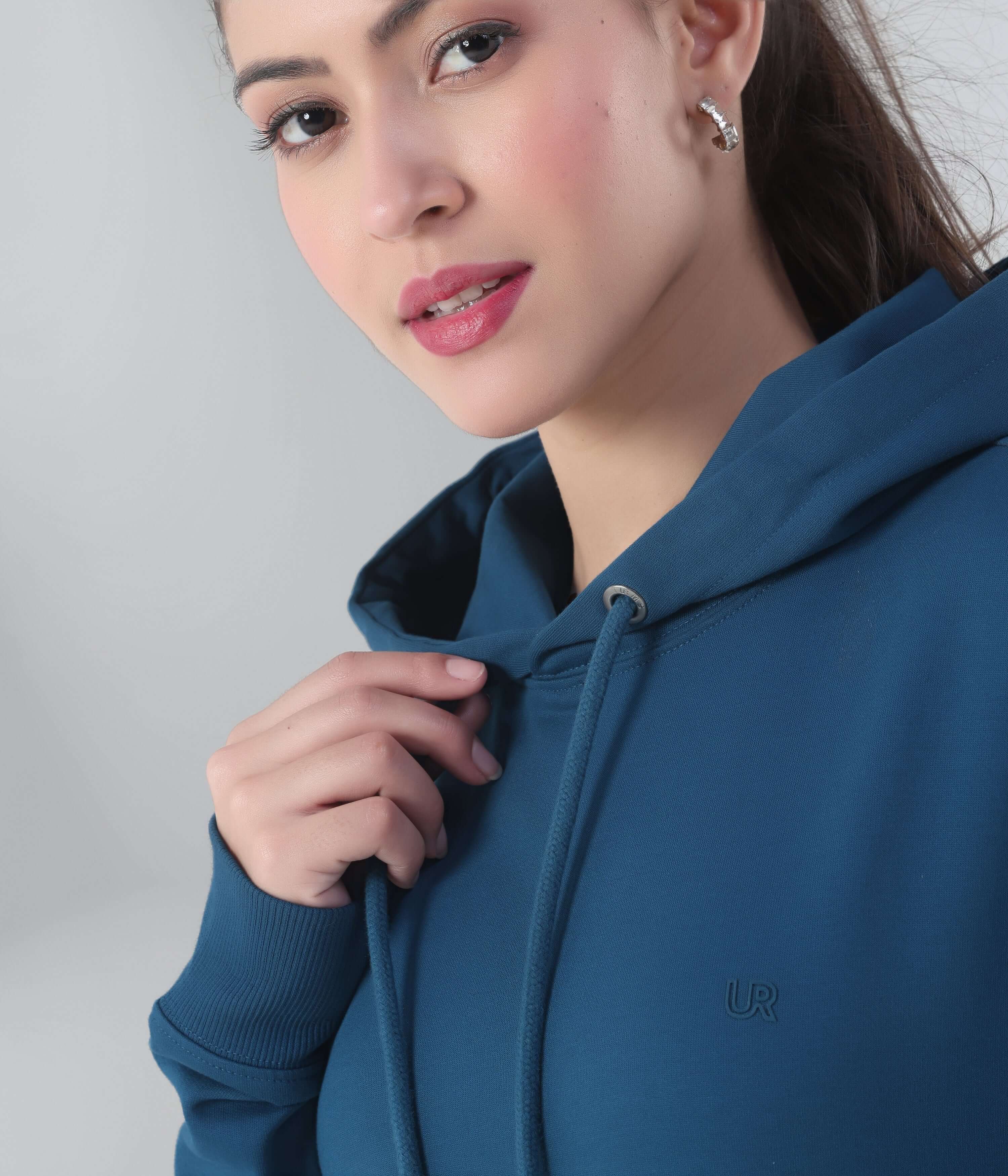 Model showcasing the Blue Desert Turms Intelligent Hooded Sweatshirt, perfect for stylish travel wear and everyday comfort.