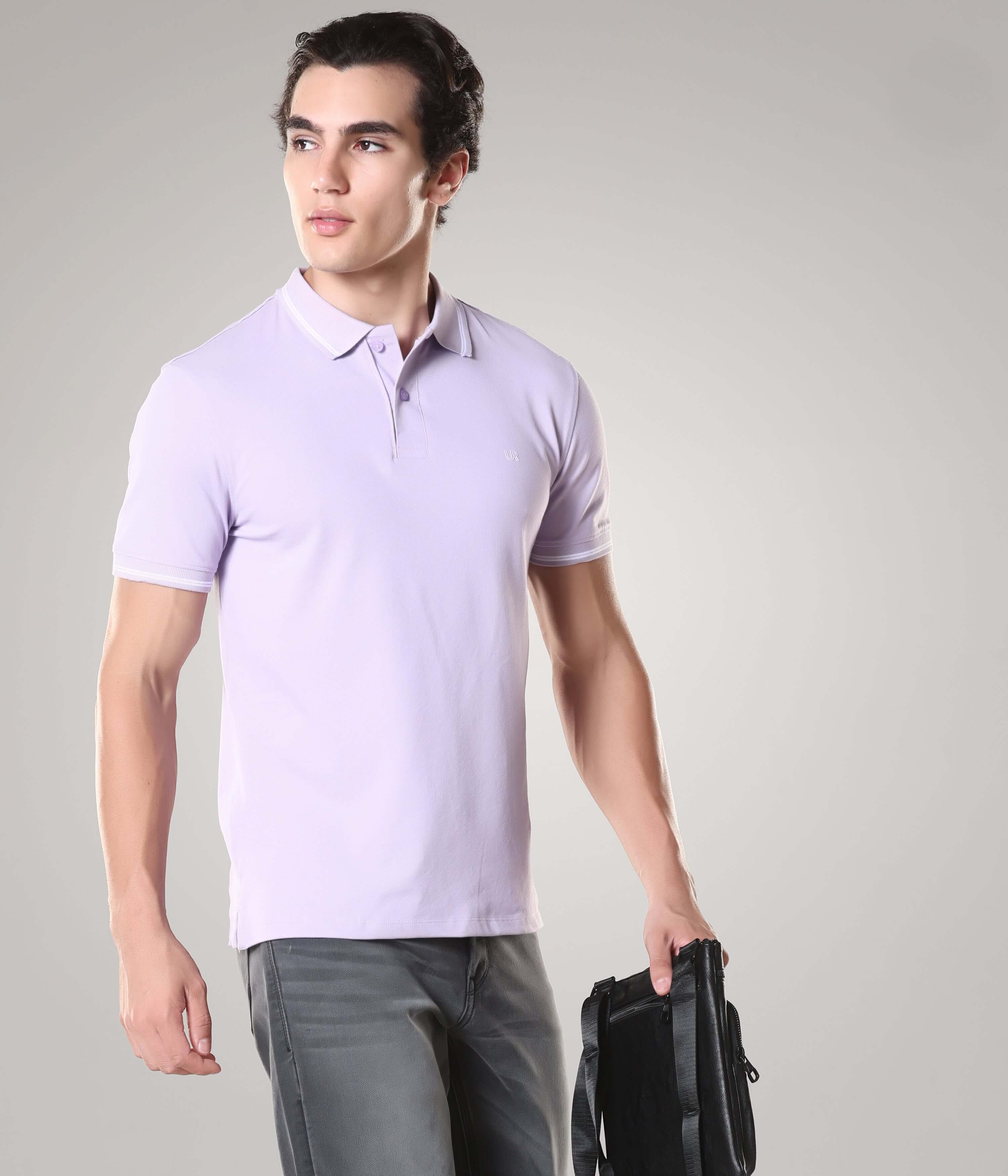 Man wearing Plume Turms Polo T-shirt with tailored fit, stain-proof, anti-odor, premium cotton blend fabric, holding a bag.