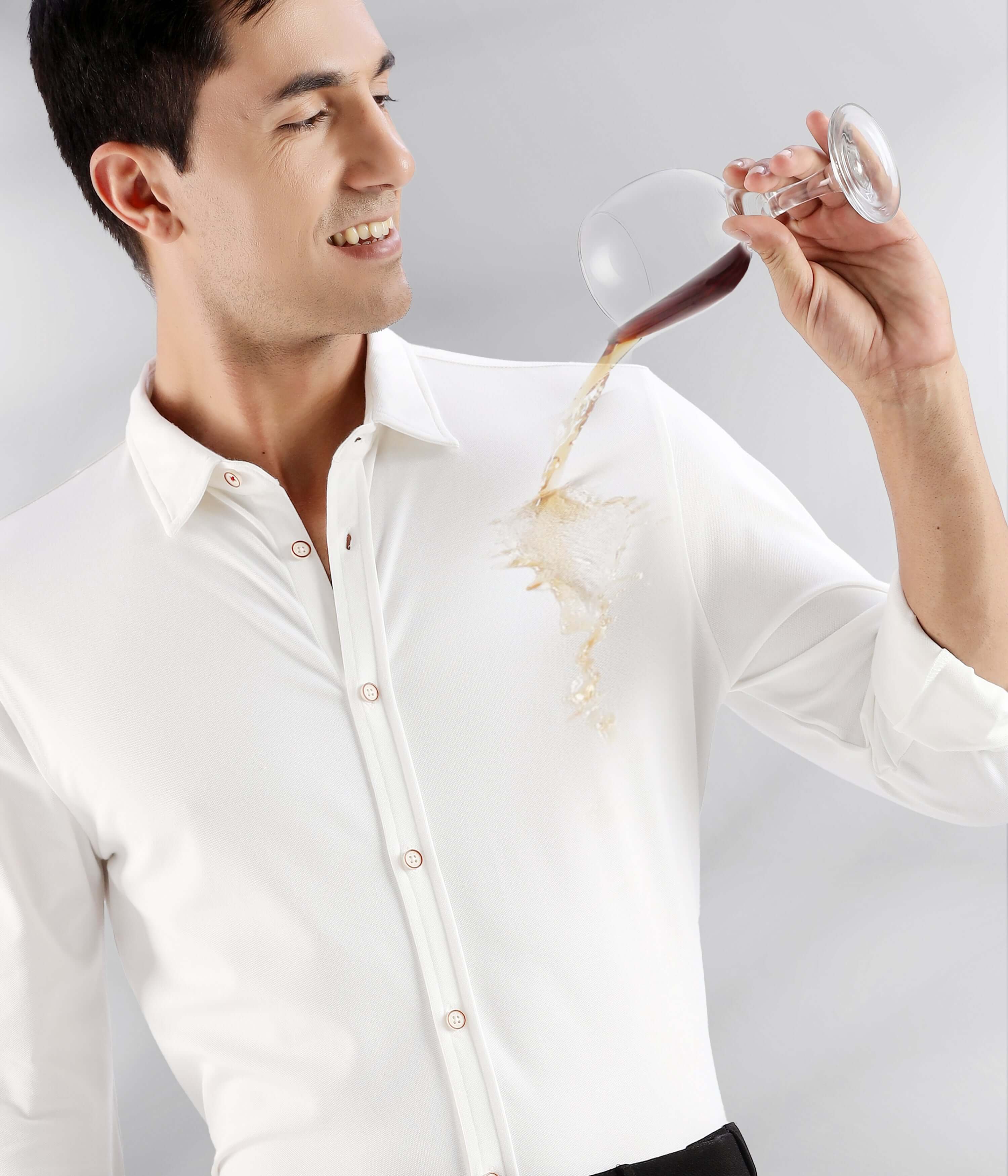 White Willow: Man in a white knitted shirt demonstrating anti-stain feature while pouring liquid.