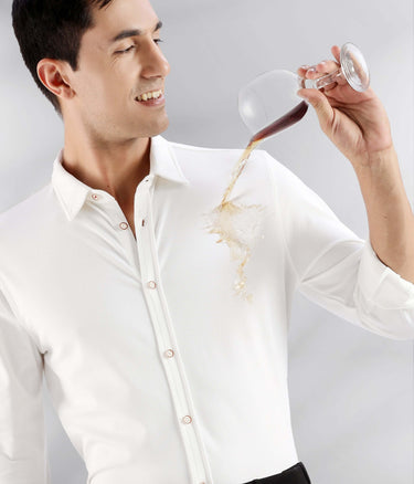White Willow: Man in a white knitted shirt demonstrating anti-stain feature while pouring liquid.