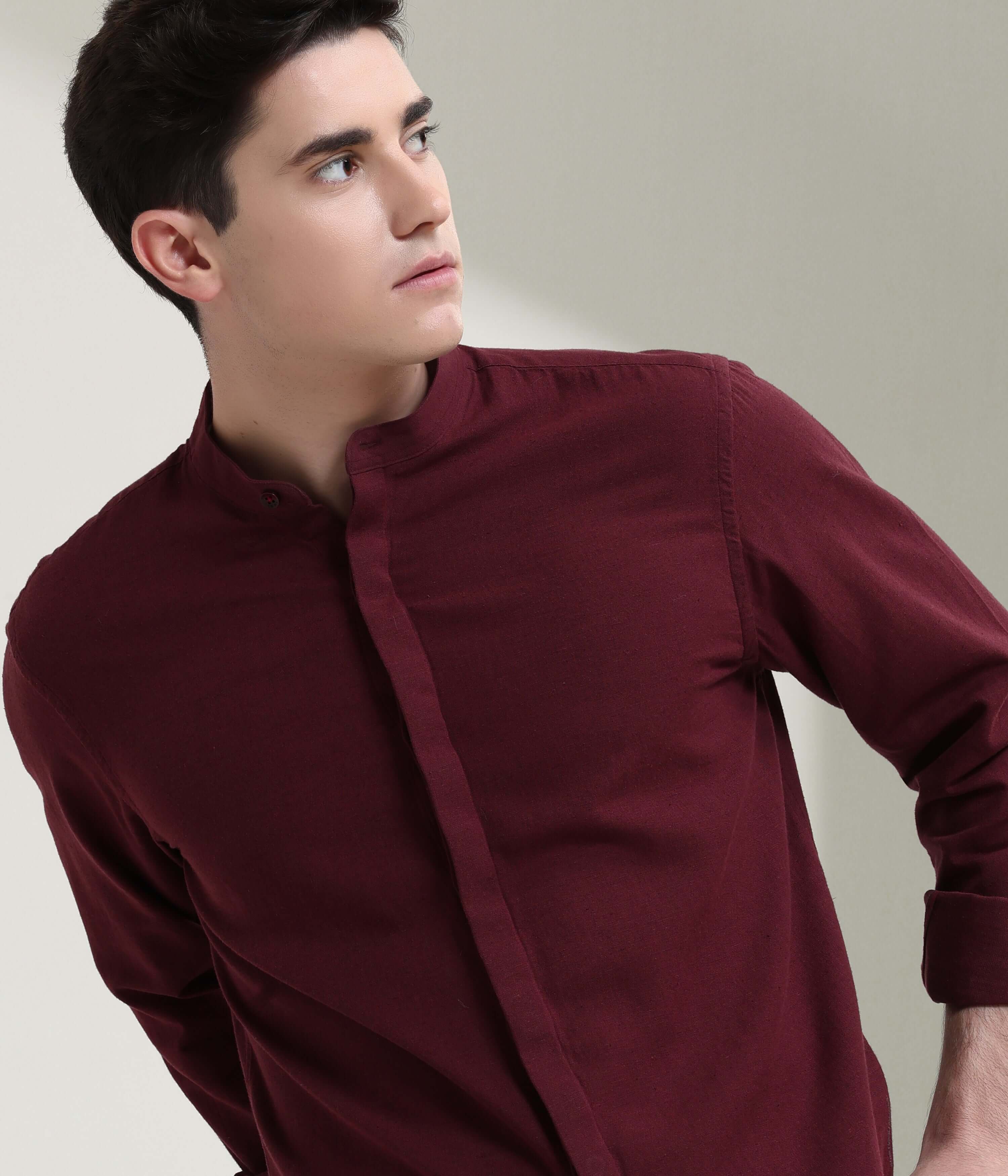 Man wearing Windsor Wine linen shirt with mandarin collar, showcasing Turms intelligent apparel's anti-stain and anti-odour features.