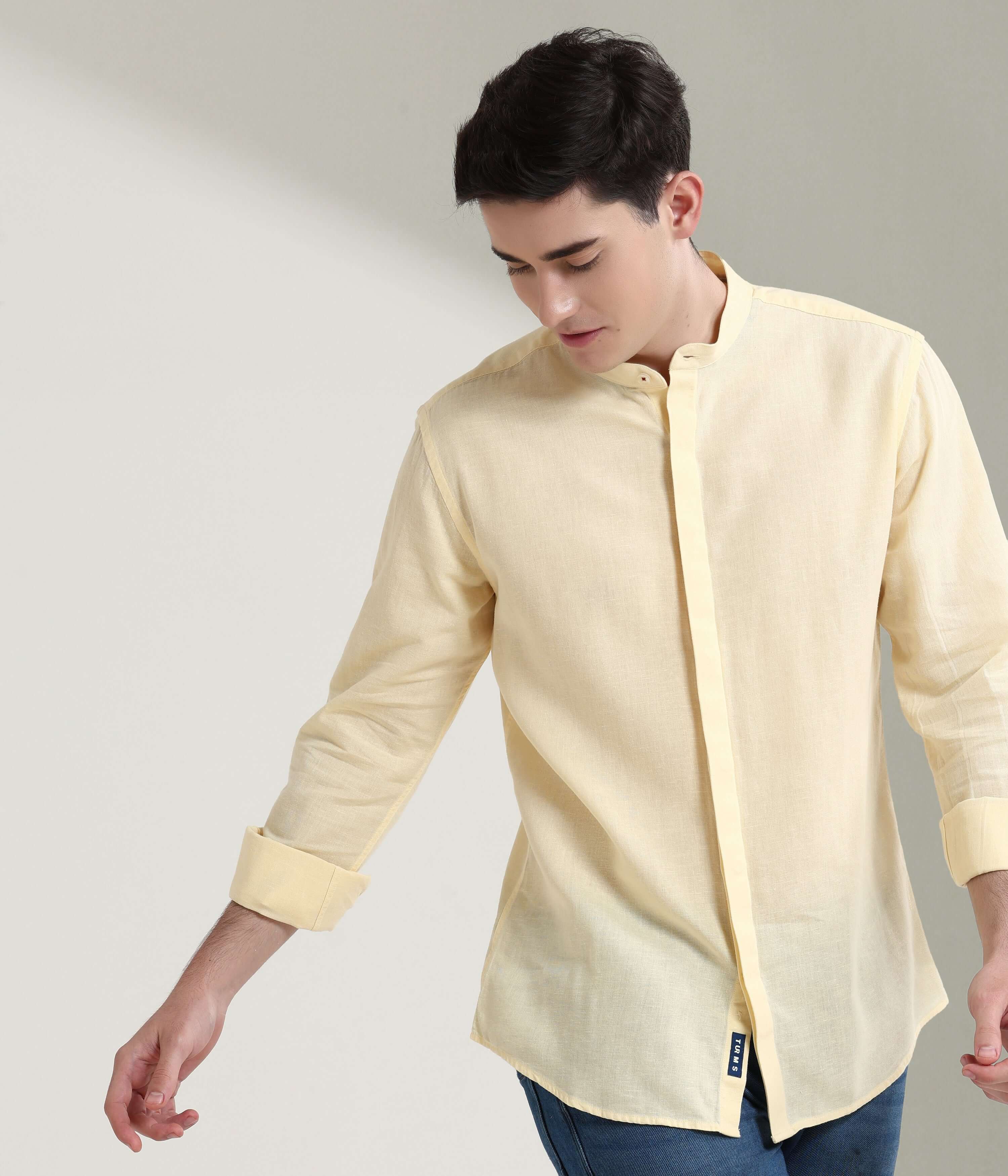 Pastel yellow linen shirt with mandarin collar, anti-stain, anti-odour, showcasing Turms intelligent apparel's luxury and durability.