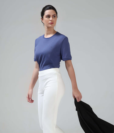 Woman wearing Blooming Orchid COOLTECH T-shirt by TURMS in new honeycomb fabric, tailored fit, anti-odour, intelligent apparel.