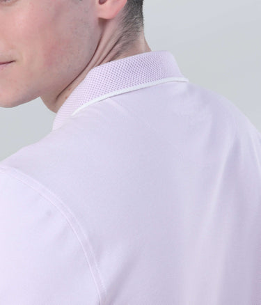 Back view of a man wearing the Lavender Breeze Turms Polo shirt, showcasing its breathable fabric and stylish design.