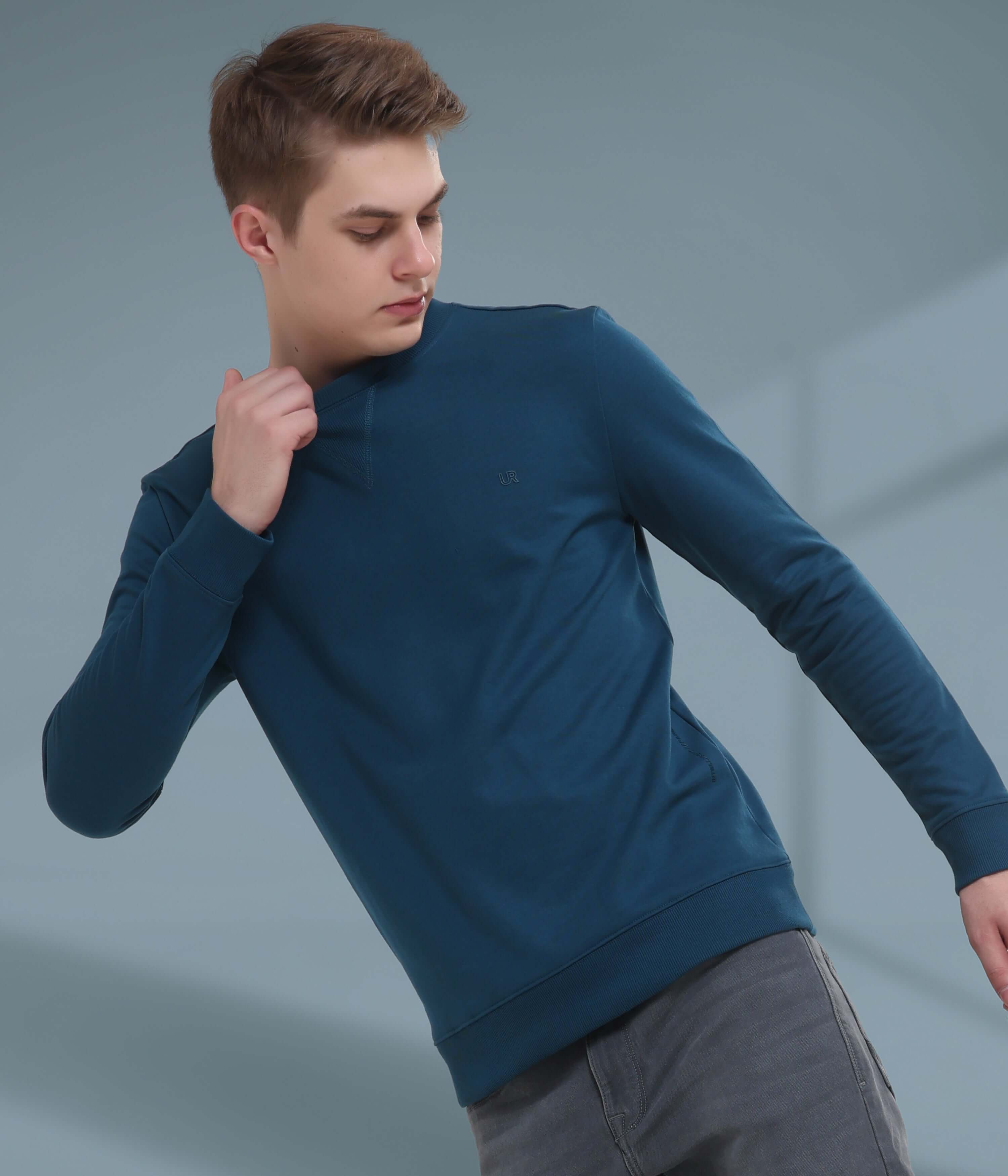 Stylish blue sweatshirt with V-notch neckline, perfect for comfort and durability in everyday wear.