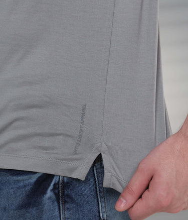 Close-up of a tailored grey polo t-shirt showcasing its stain-resistant fabric and side seam detail.