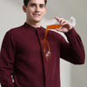 Man demonstrates anti-stain wine-red linen shirt with mandarin collar from Turms intelligent apparel collection.