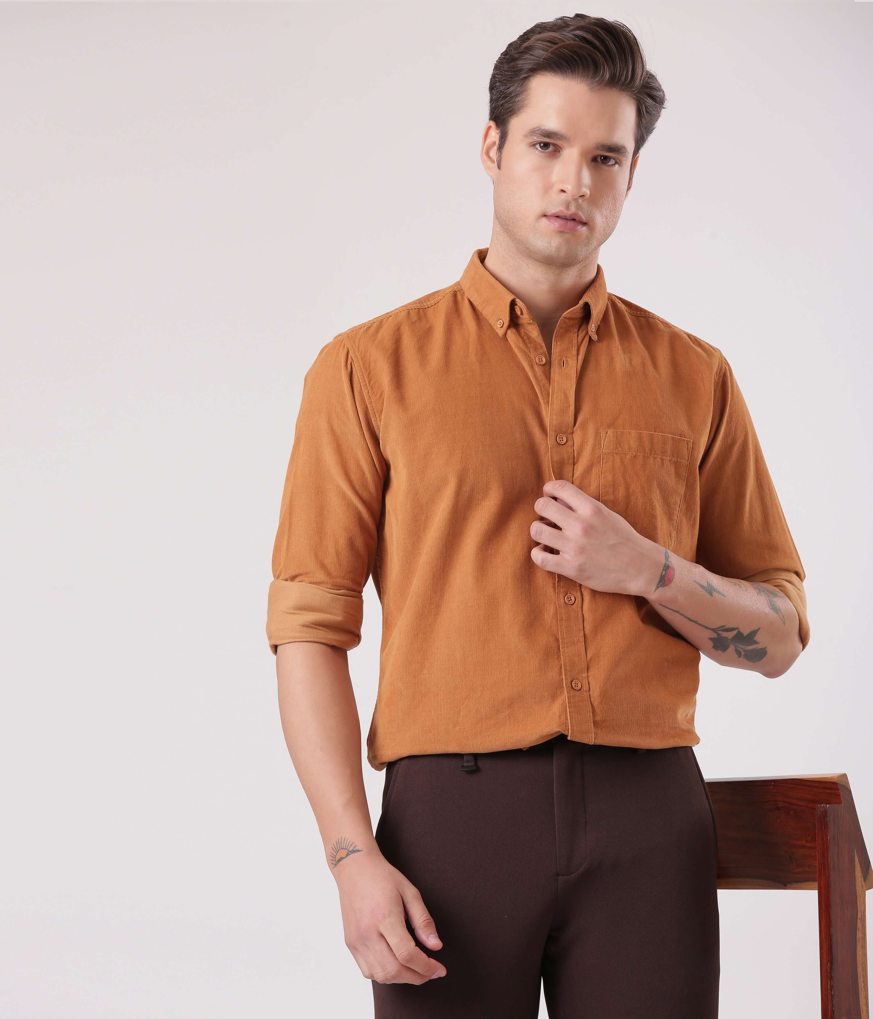 Brown Toffee corduroy shirt with water proof turms intelligent apparel modeled by a man in a stylish pose.