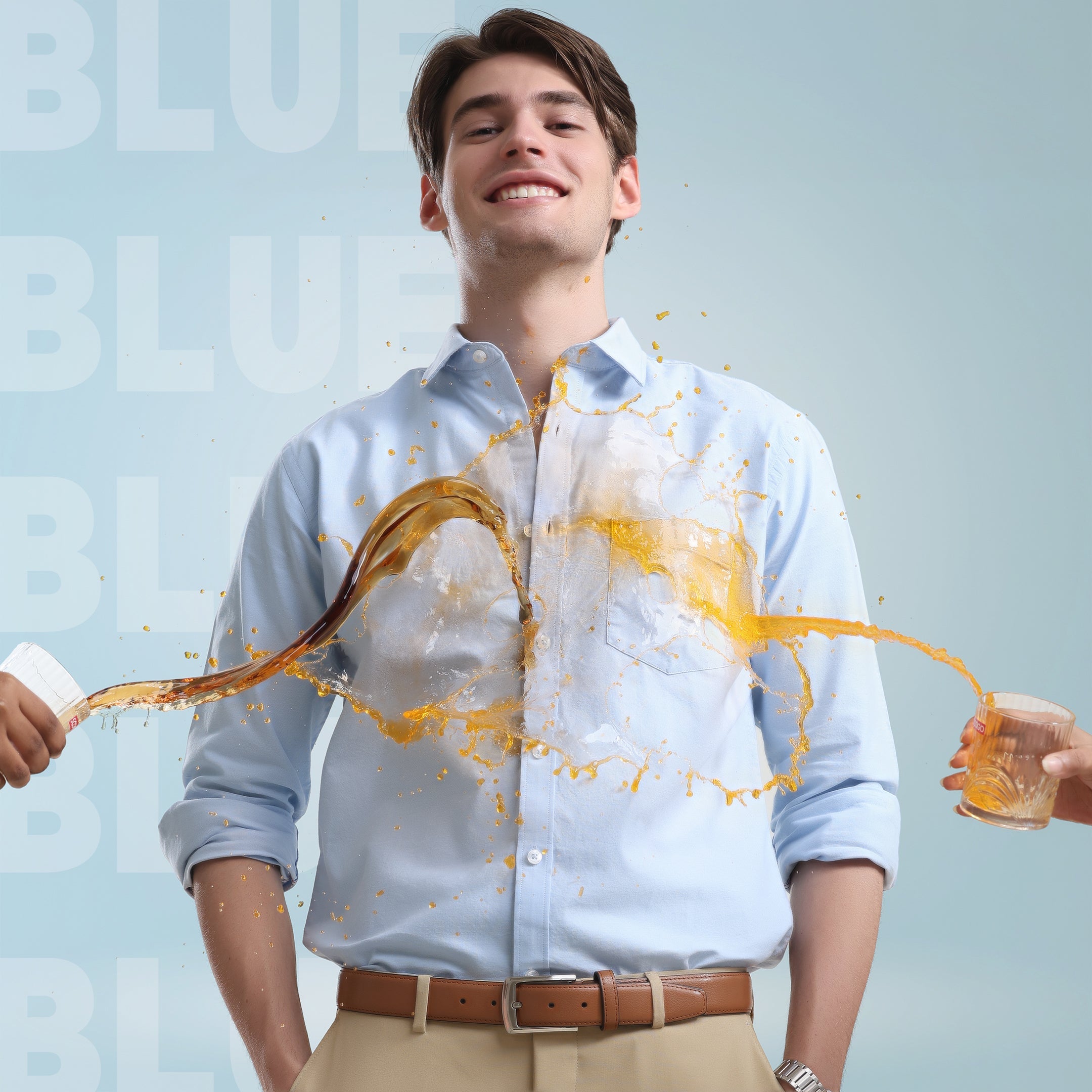 Man wearing Nautical Blue Oxford Turms shirt demonstrating anti-stain feature as liquid spills without leaving marks.