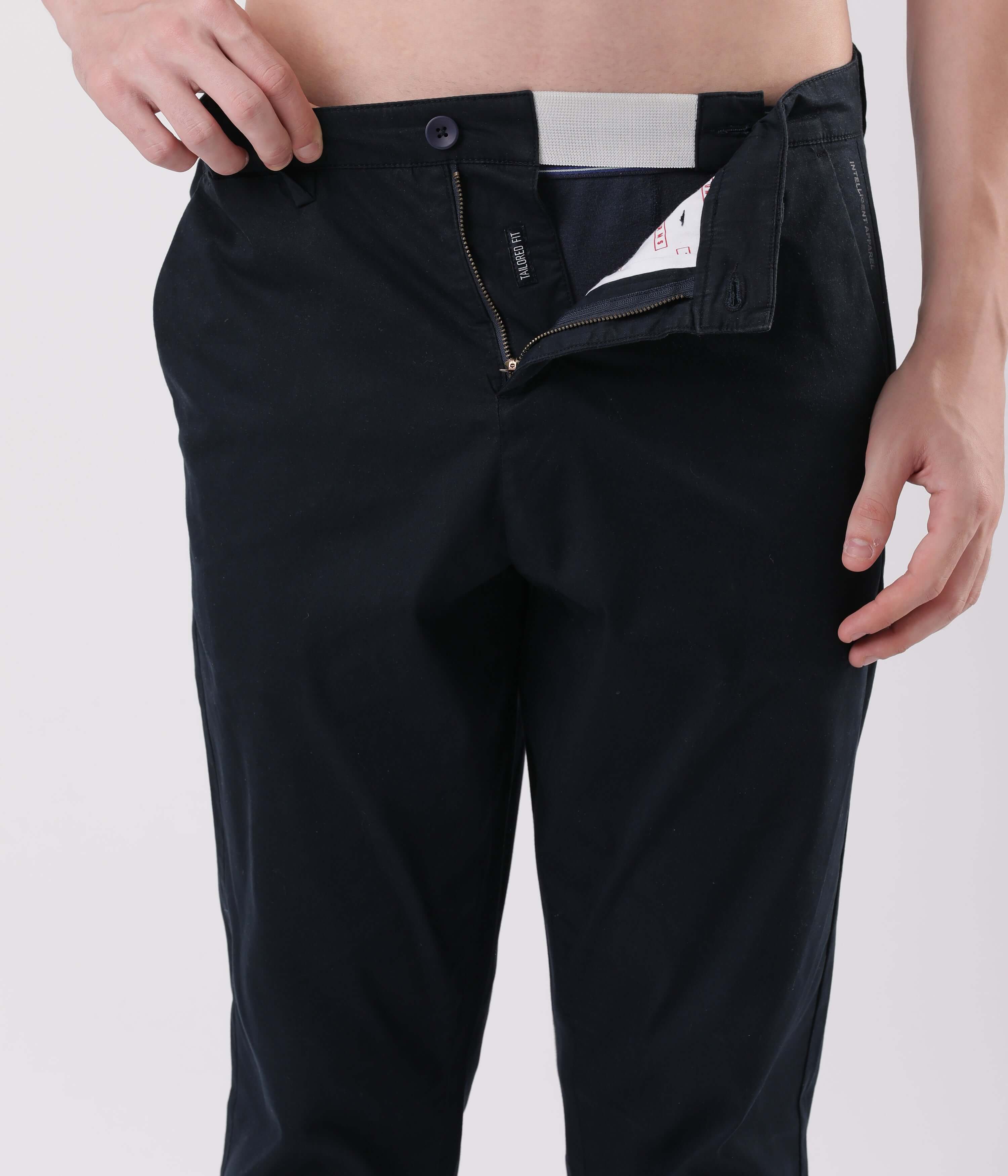 Model showing the front zipper of Turms Blue Eyed Intelligent Smart flex Chino with detailed stitching.