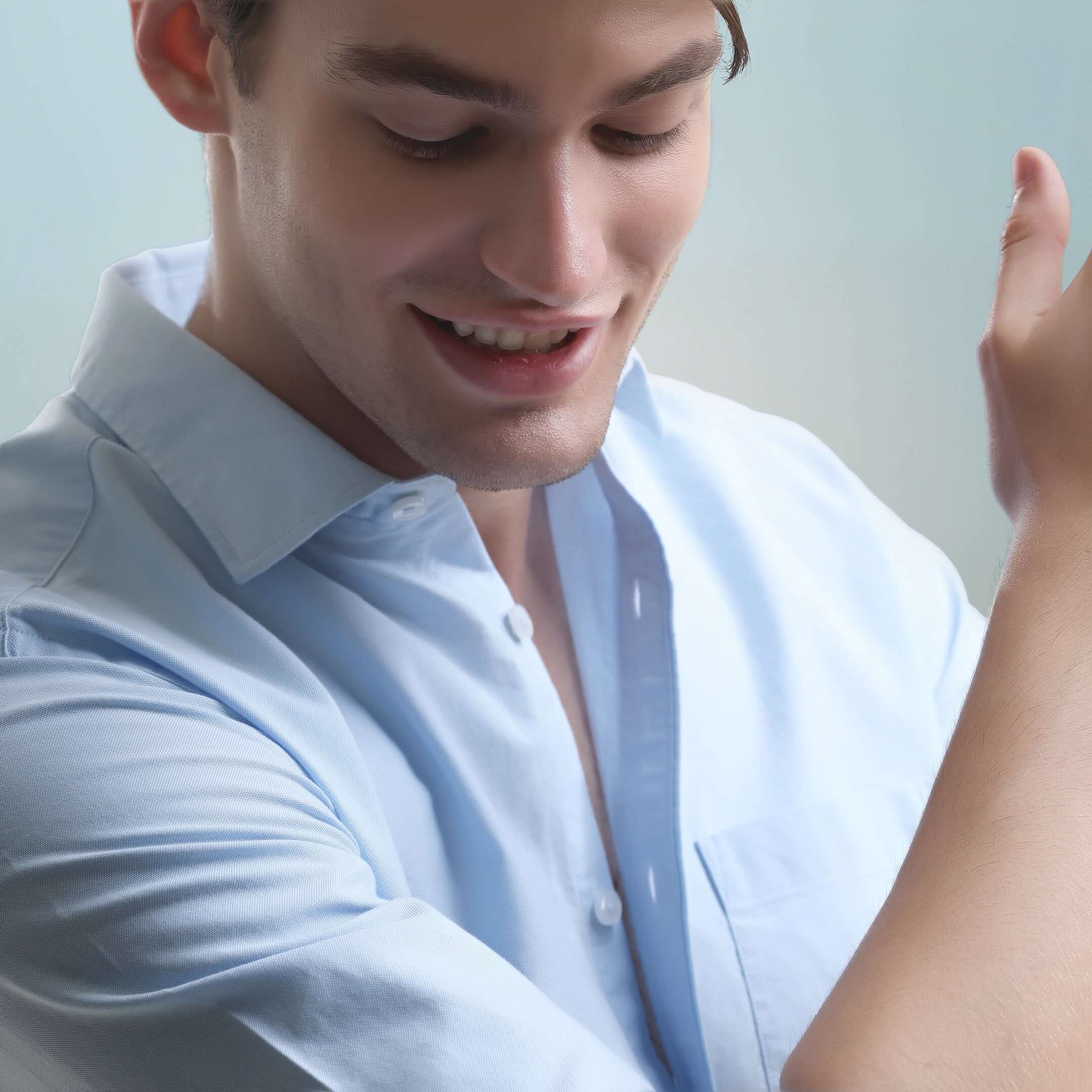 Man wearing a Nautical Blue Oxford Turms intelligent apparel shirt made of premium cotton, showcasing its anti-stain and anti-odour features.