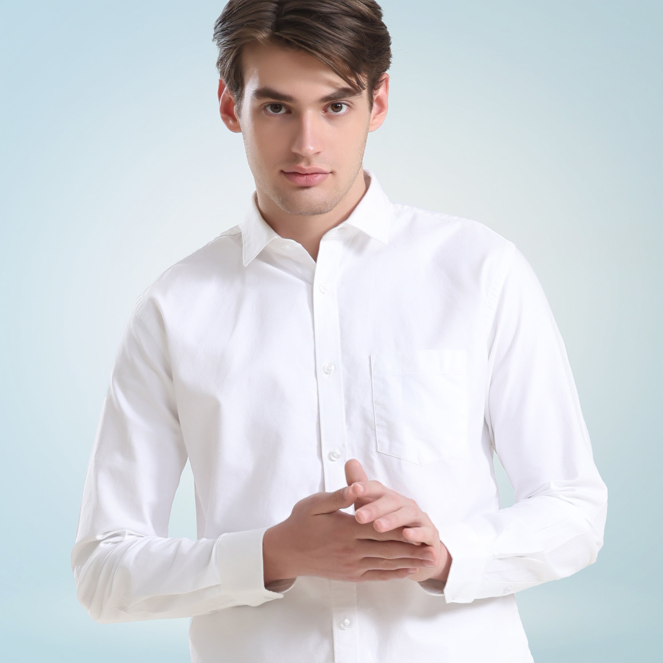 Man wearing Moonlite White Oxford Turms shirt made from premium super combed cotton, showcasing anti-stain and anti-odor properties.