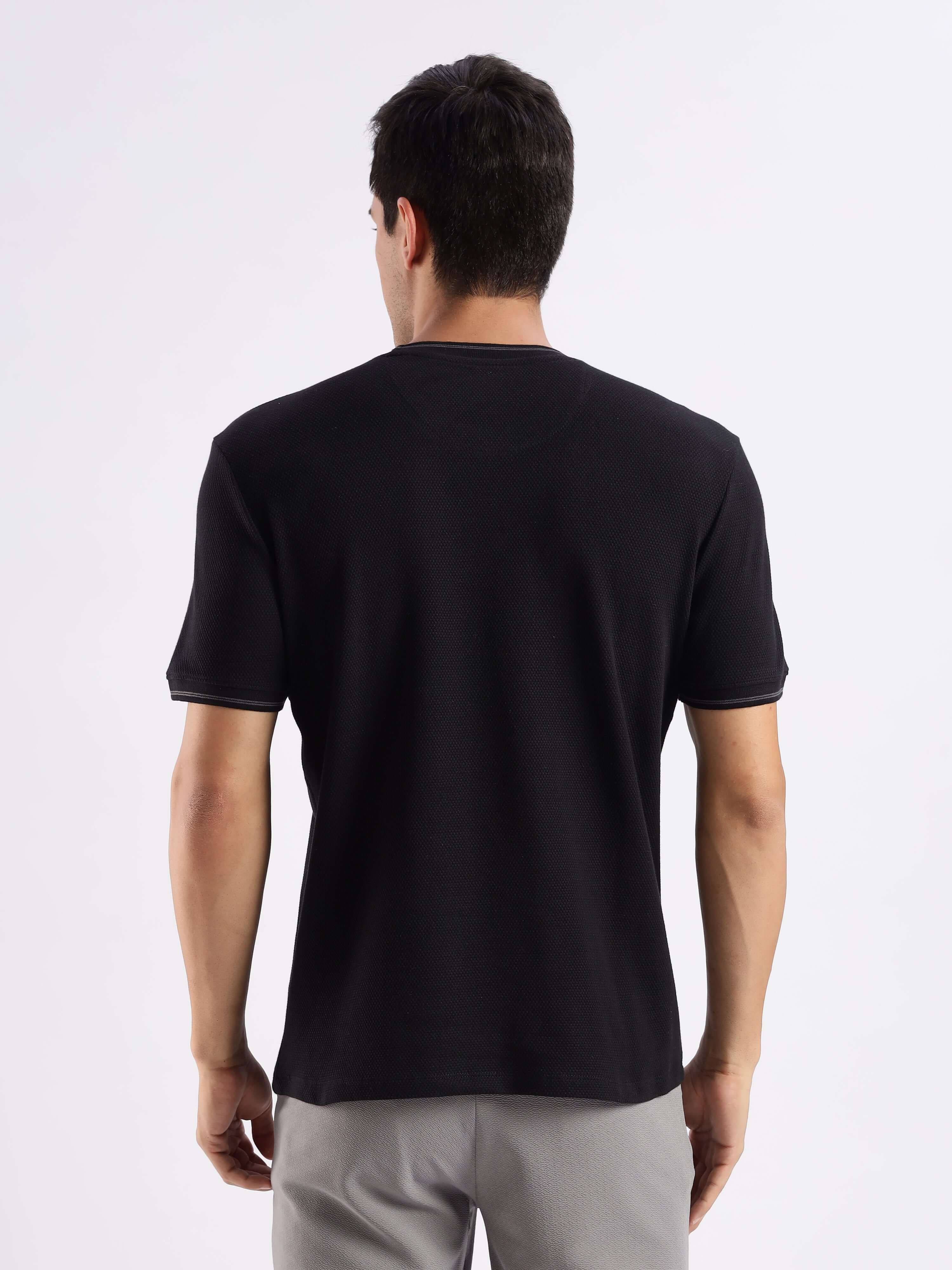 Back view of Mandalorian Black knitted shirt showcasing its comfort and 8-way stretch design for everyday wear.
