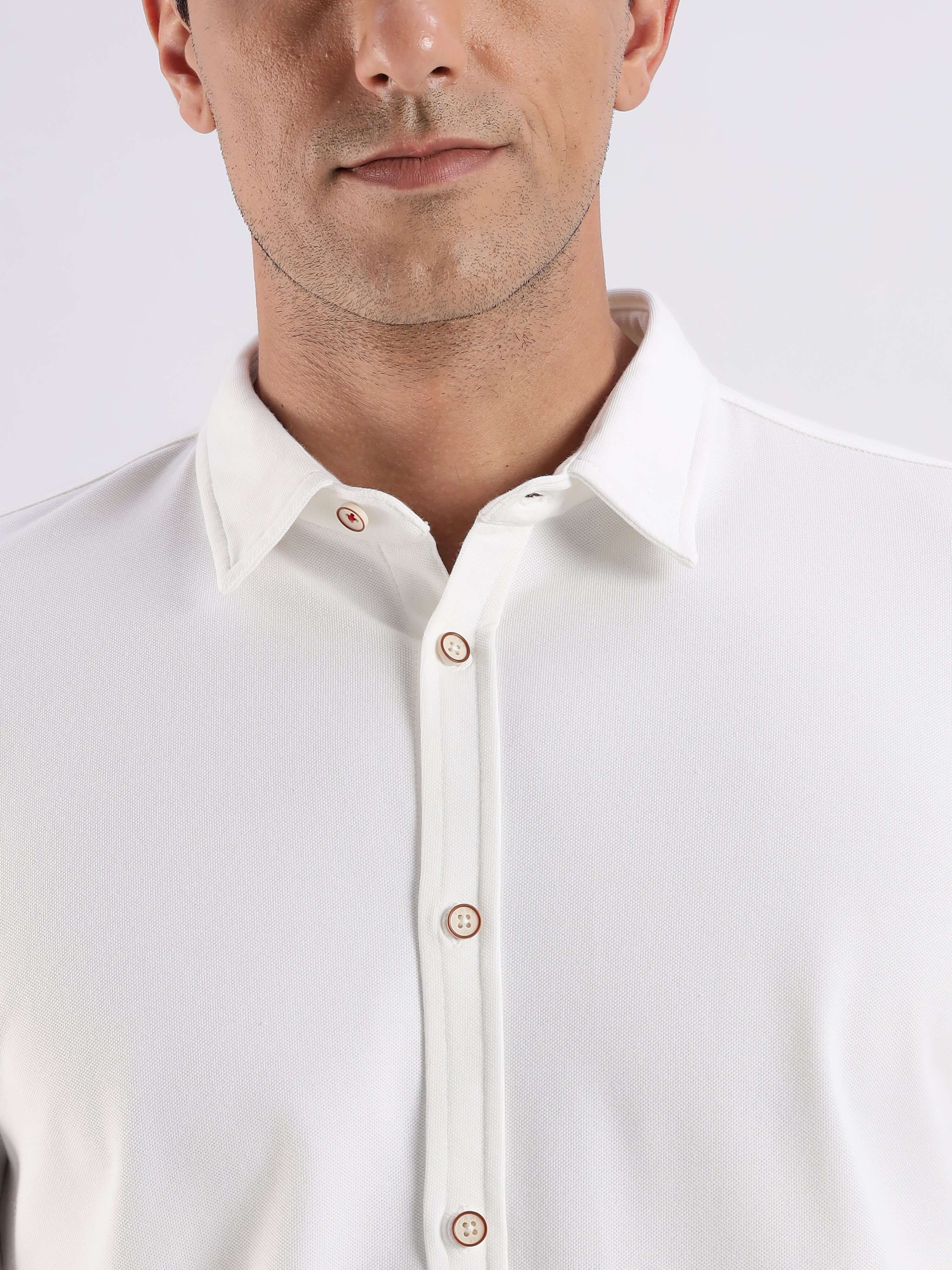 Model wearing a White Willow knitted shirt showcasing premium quality and 8-way stretch for comfort.