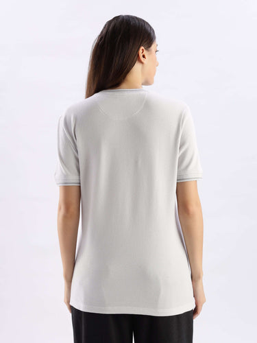 Back view of a woman wearing the Nova Grey cooltech tshirt, showcasing a comfortable round neck design.