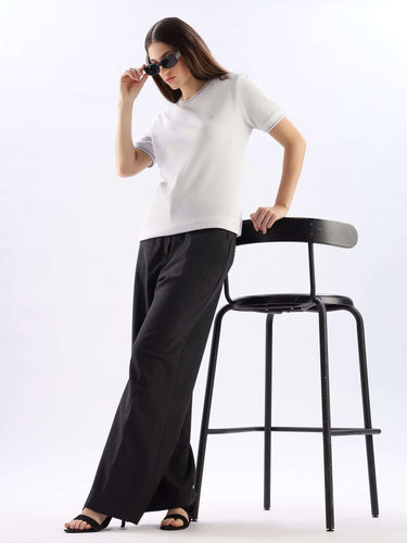 Model wearing Nova Grey round neck cooltech t-shirt with black trousers, exuding comfort and style.