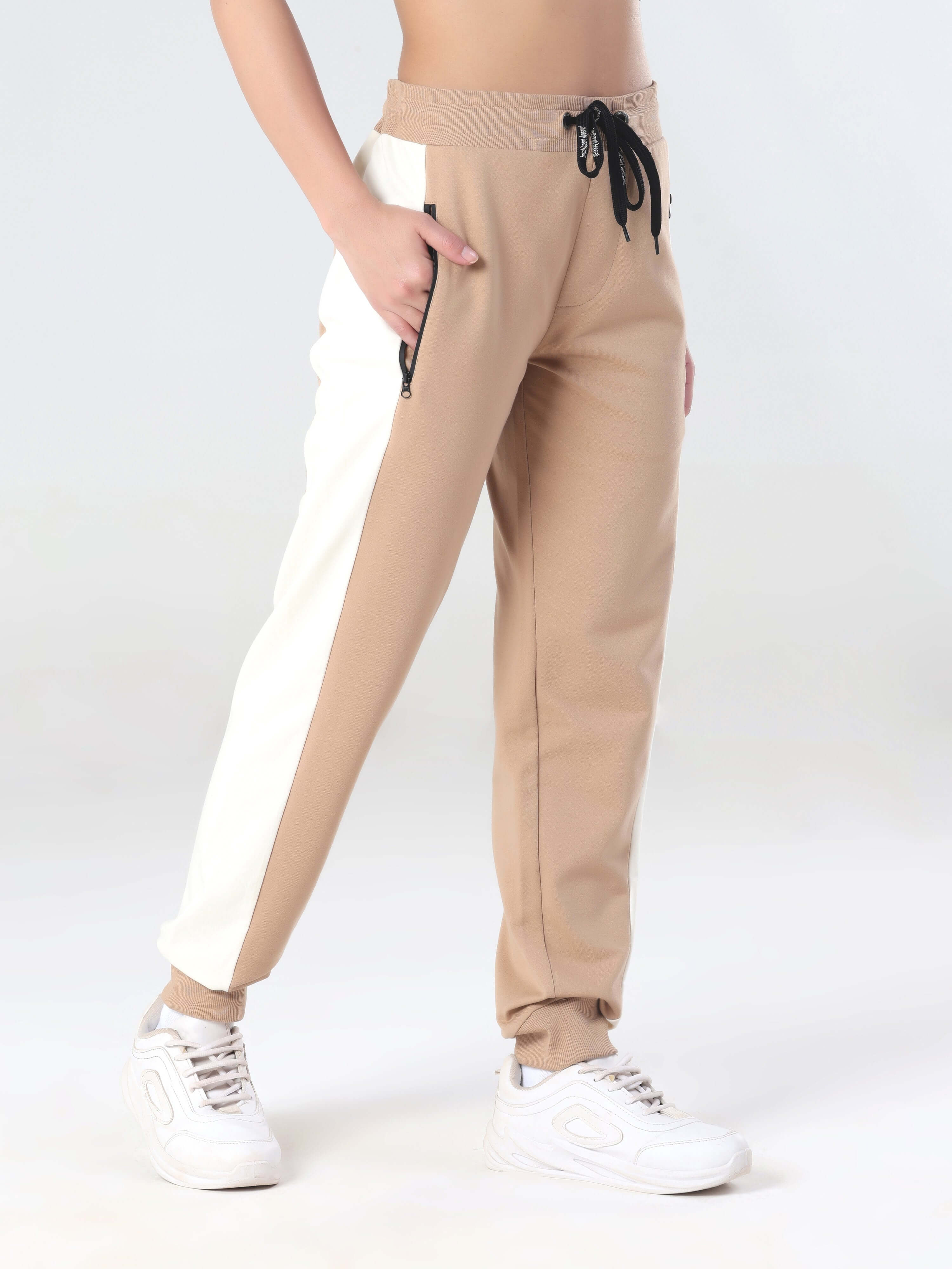 Stylish beige and white joggers for women, perfect for travel wear and everyday comfort with anti-stain features.