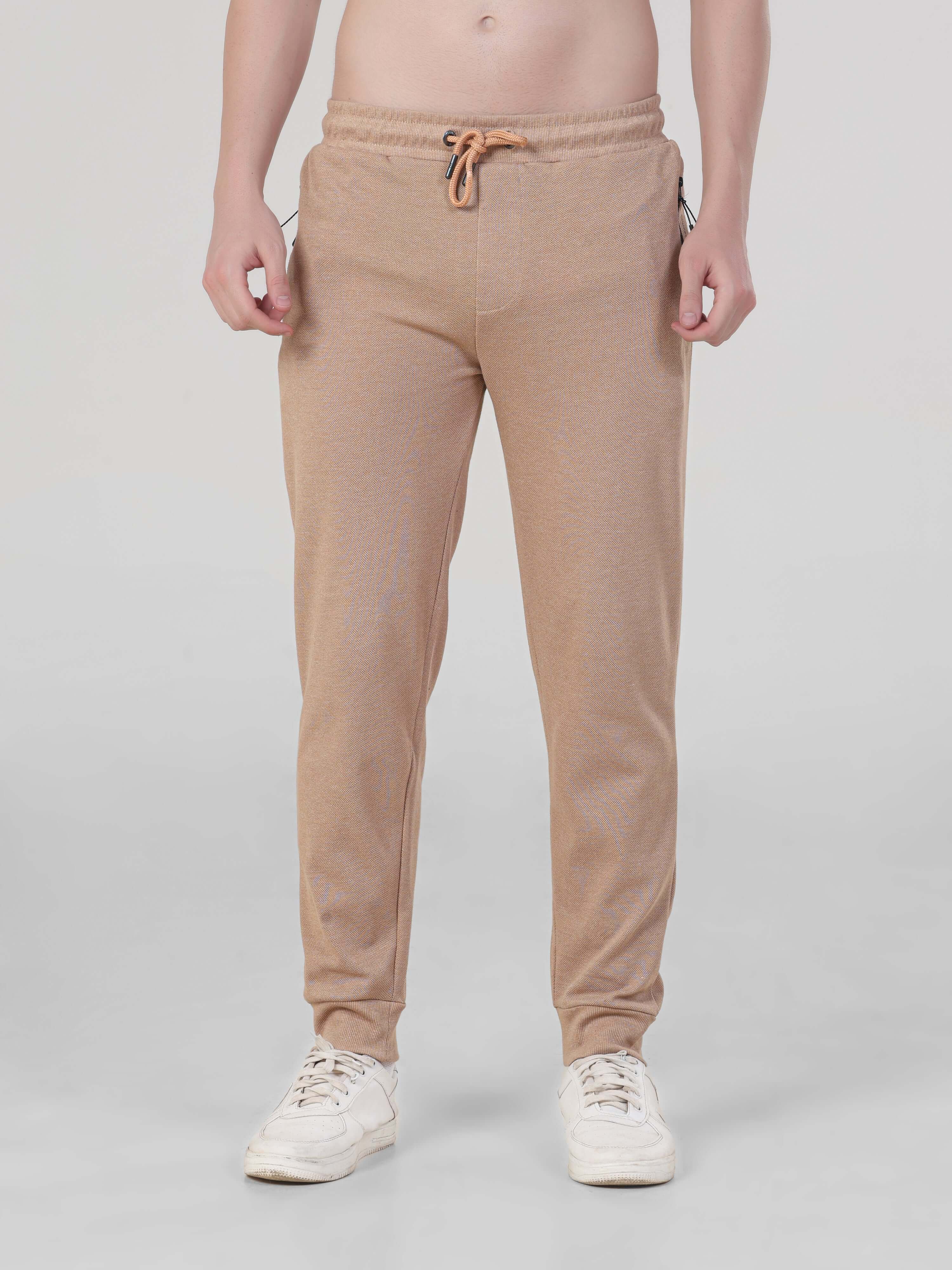 Sahara Beige Turms Intelligent Jogger for men, waterproof, anti-stain, anti-odour, and stretchable for travelers.