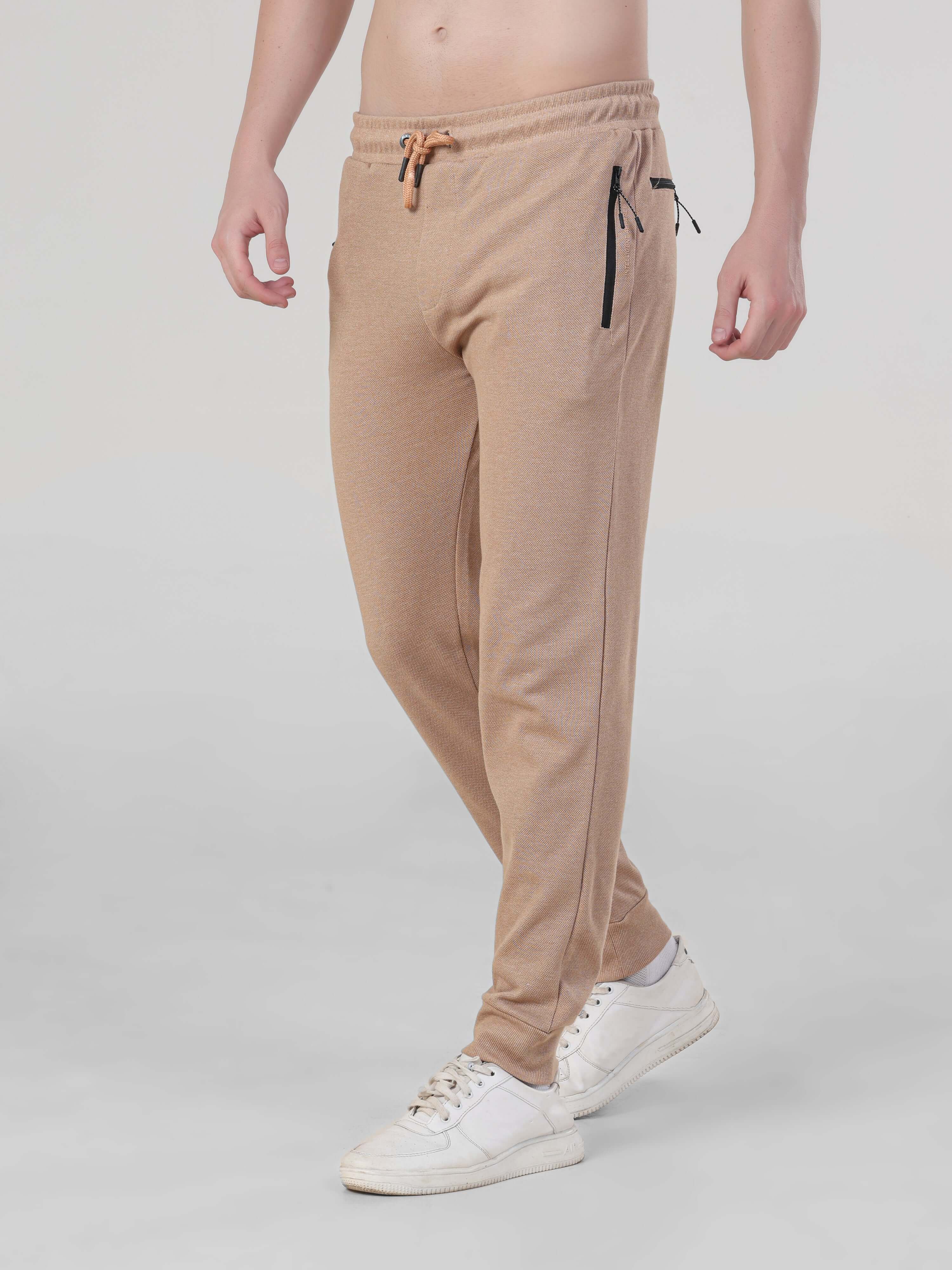 Sahara Beige Turms Intelligent Jogger for men, waterproof, anti-stain, anti-odour, and stretchable design, perfect for travelers.