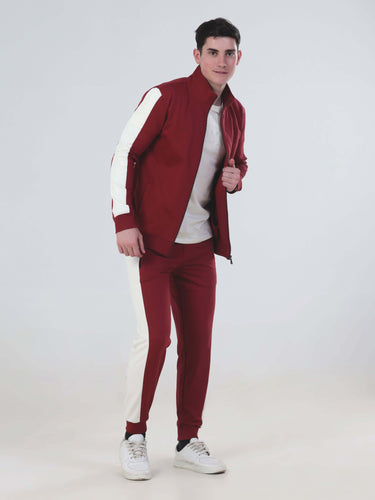 Model wearing Ruby Hunter Turms Intelligent Cord Set in red and white, showcasing stylish, water-resistant, anti-odour athletic wear.