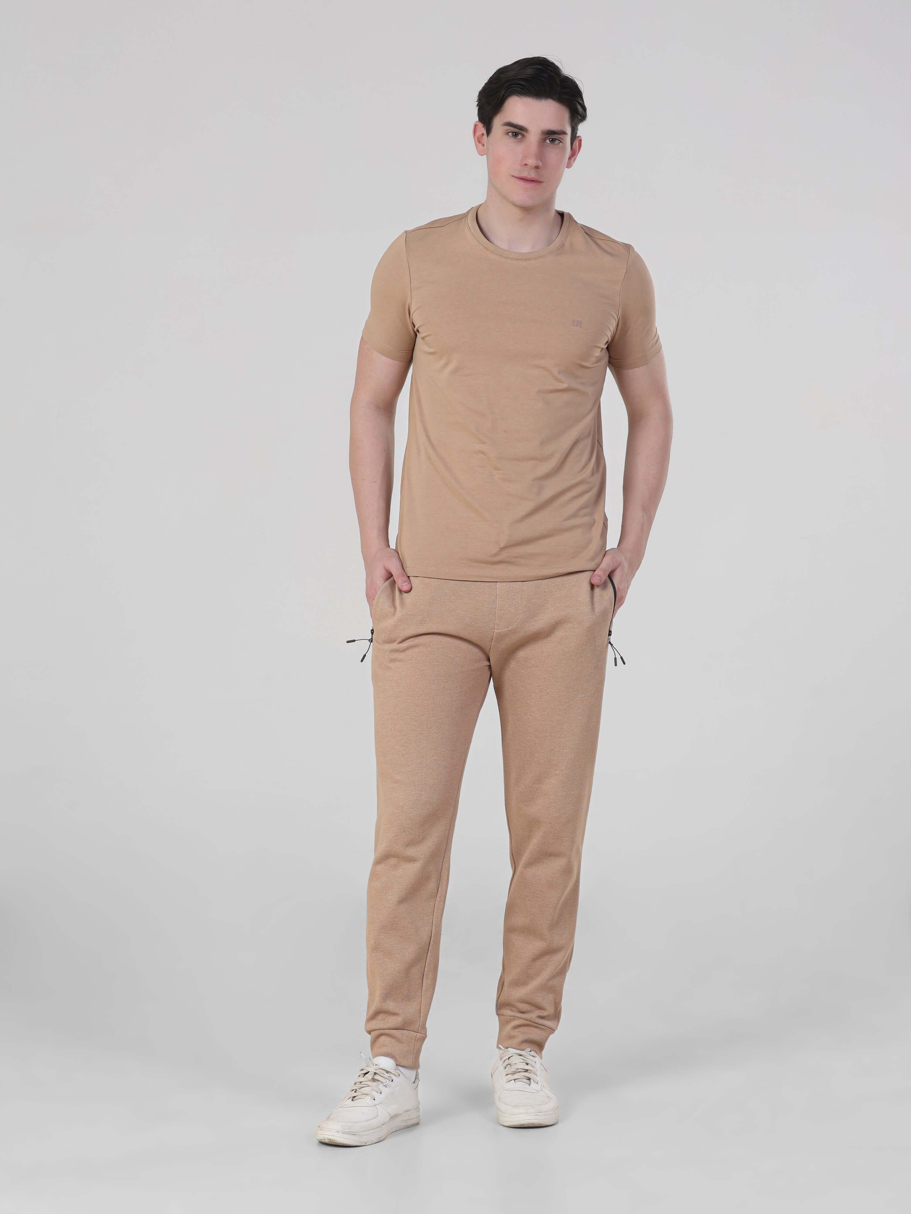 Sahara Beige Turms Intelligent Jogger set for men, waterproof, anti-stain joggers with stretchable comfort, perfect for travelers.