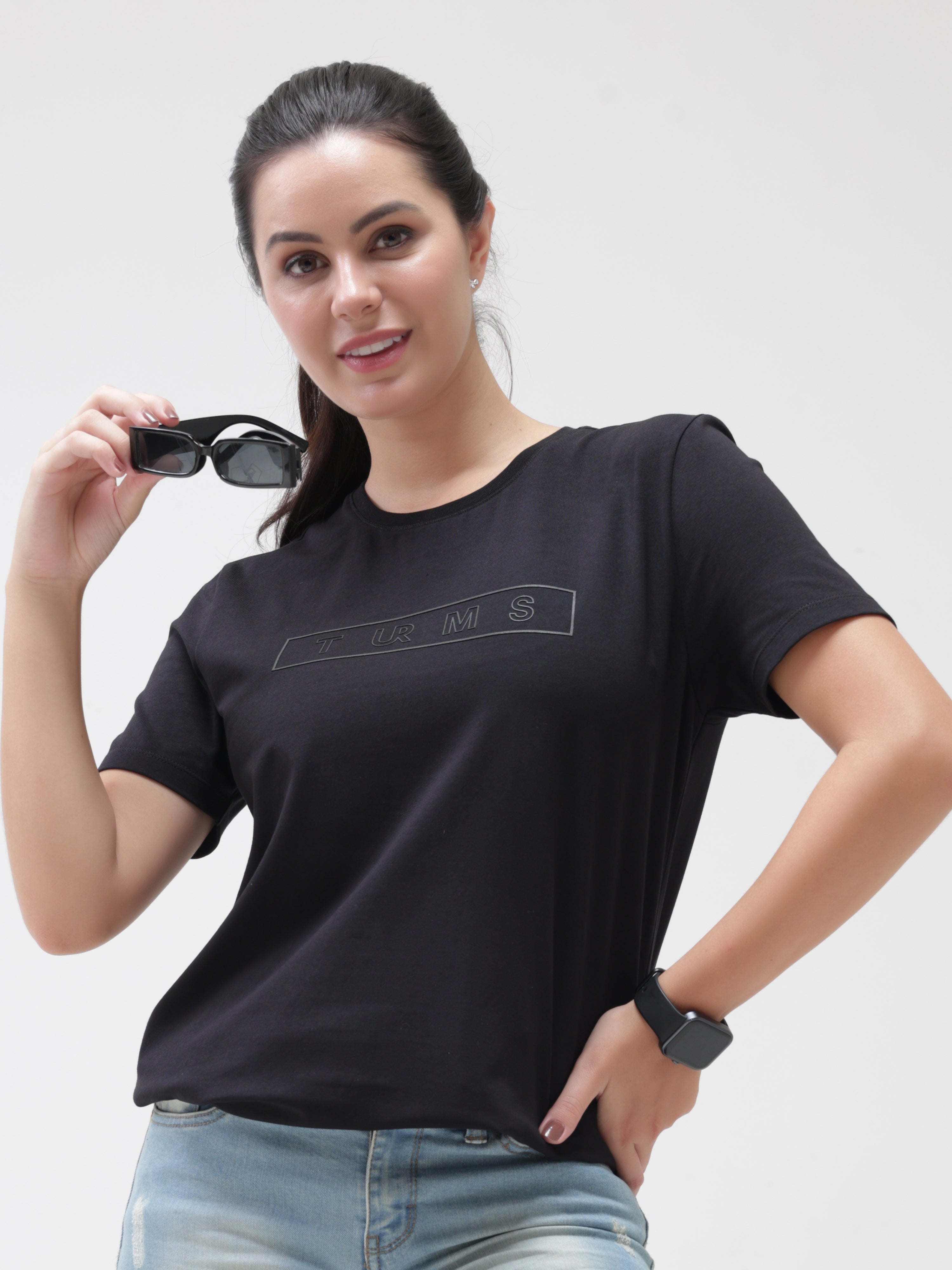 Woman wearing Midnight Elegance black Turms T-shirt, tailored fit, round neck, anti-stain, anti-odour, stretchable, intelligent apparel