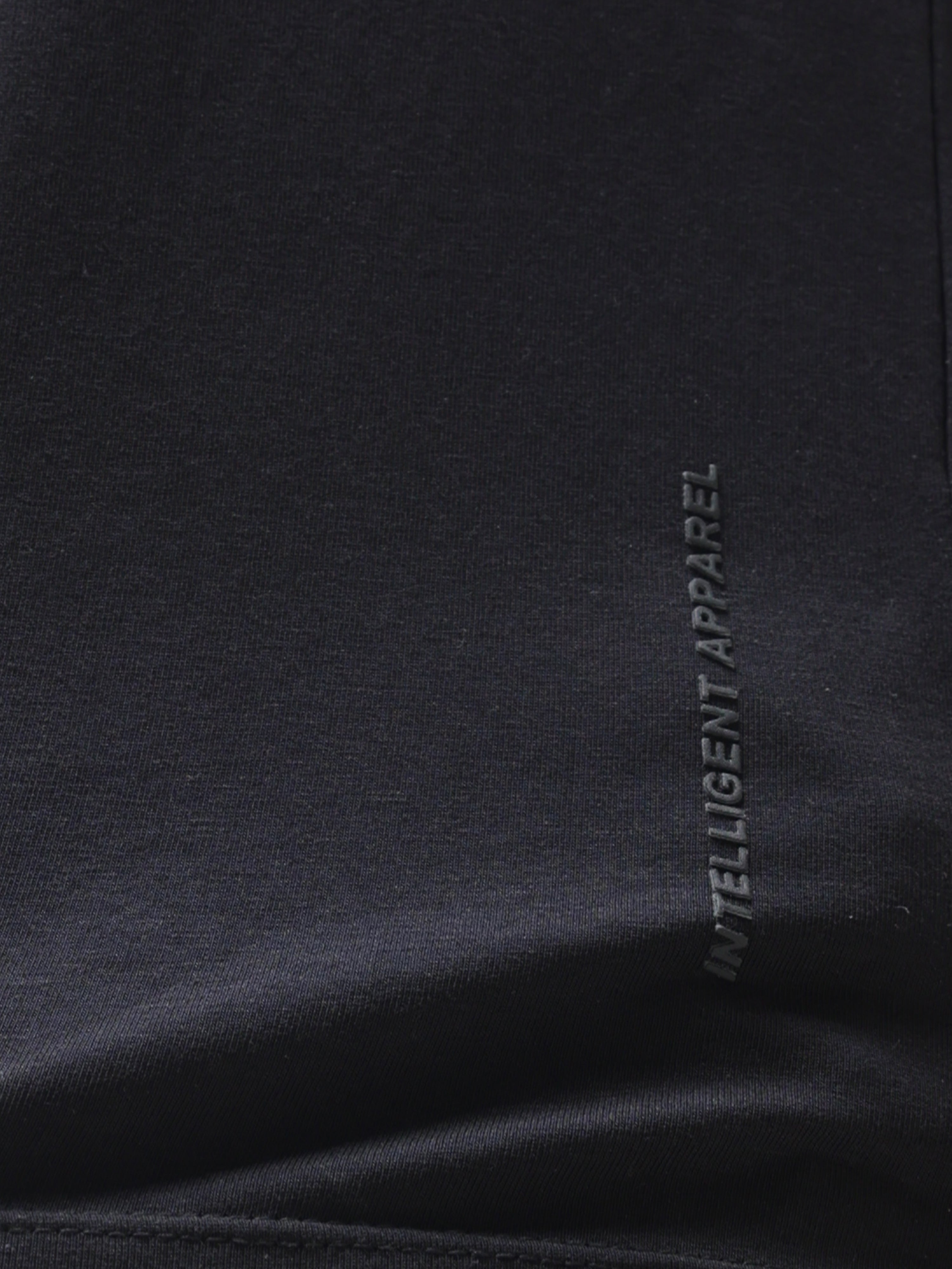 Close-up of Midnight Elegance Turms T-shirt, featuring "Intelligent Apparel" text, showcasing anti-stain, anti-odour, and stretchable fabric.